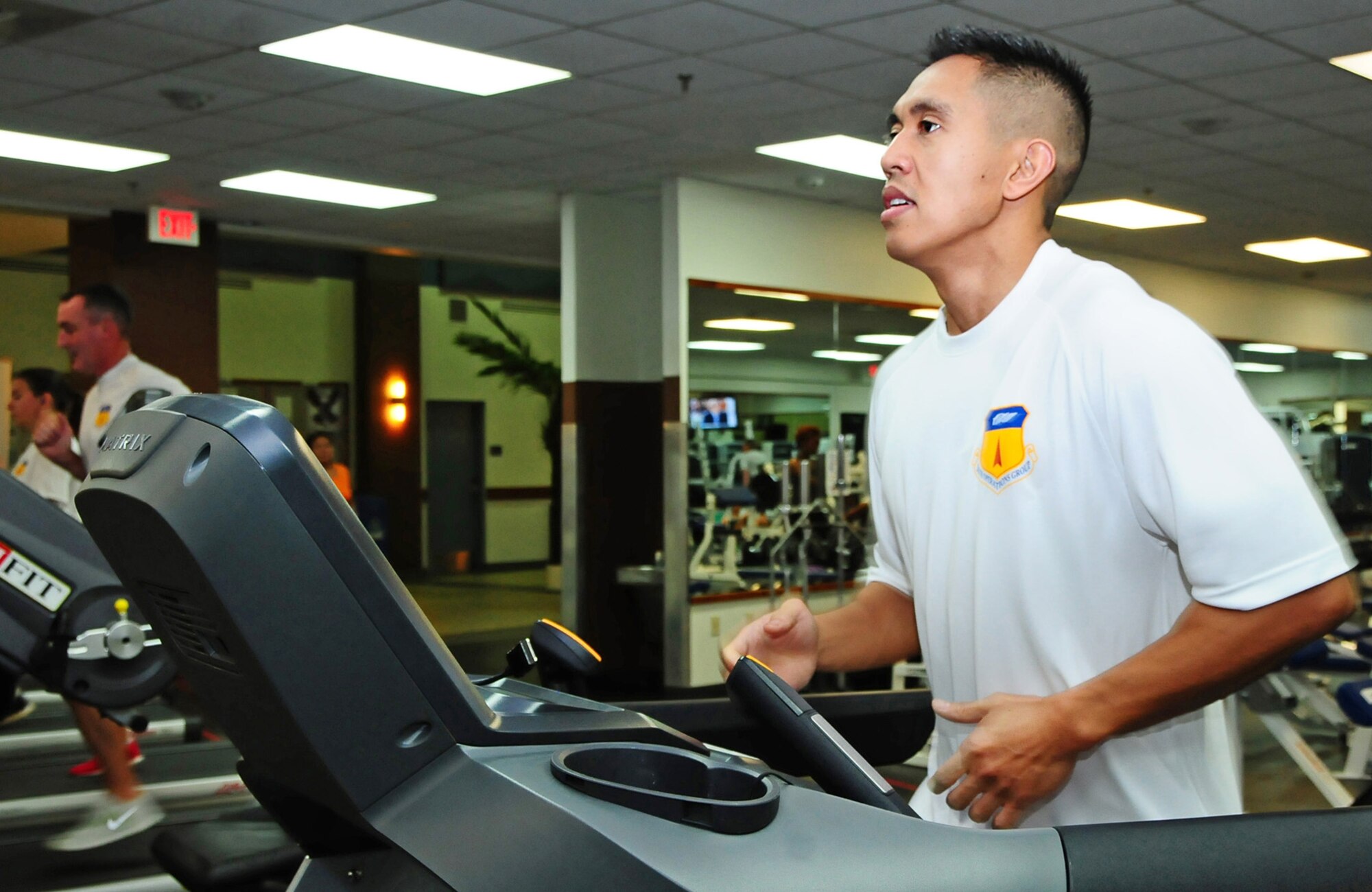 ANDERSEN AIR FORCE BASE, Guam – Tech. Sgt. Kenner Sagorsor, 36th Operations Group resource adviser, runs on the treadmill in order to accomplish goals in the running portion of the 360 challenge, Aug. 3. With physical fitness being a huge part of Airmen’s lives, along with the 36th Wing’s goal of getting 90 percent of the Airmen on base at 90 or above on their fitness tests, the 36th OG staff leads the way in getting creative for a healthy cause. (U.S. Air Force photo by Airman 1st Class Marianique Santos/Released)