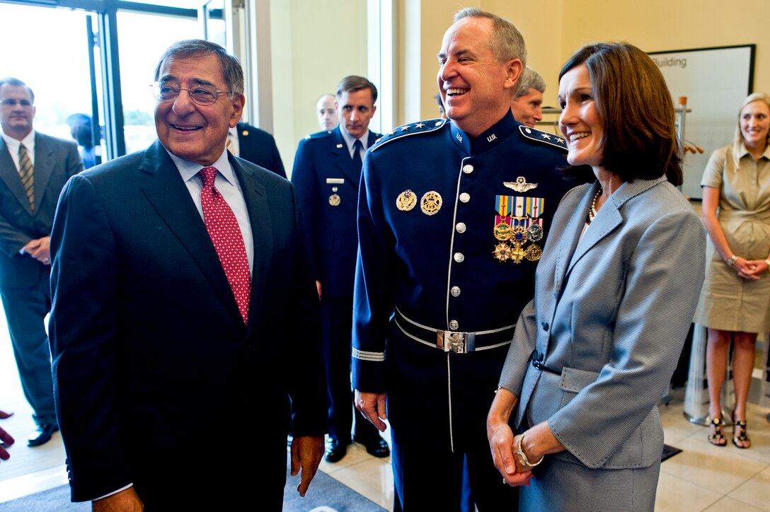 Defense Secretary Leon E. Panetta speaks with Air Force Gen. Mark A. Welsh III and his wife, Betty, at the Air Force Retirement and Appointment Ceremony, where Welsh succeeded Air Force Chief of Staff Gen. Norton A. Schwartz as the 20th chief of staff on Joint Base Andrews, Md., Aug. 10, 2012.