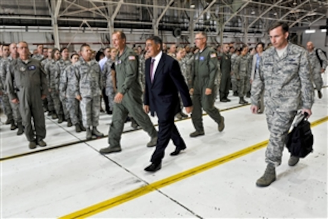 Defense Secretary  Leon E. Panetta walks by service members in formation as he departs Niagara Falls Air Reserve Station, N.Y., Aug. 9, 2012.