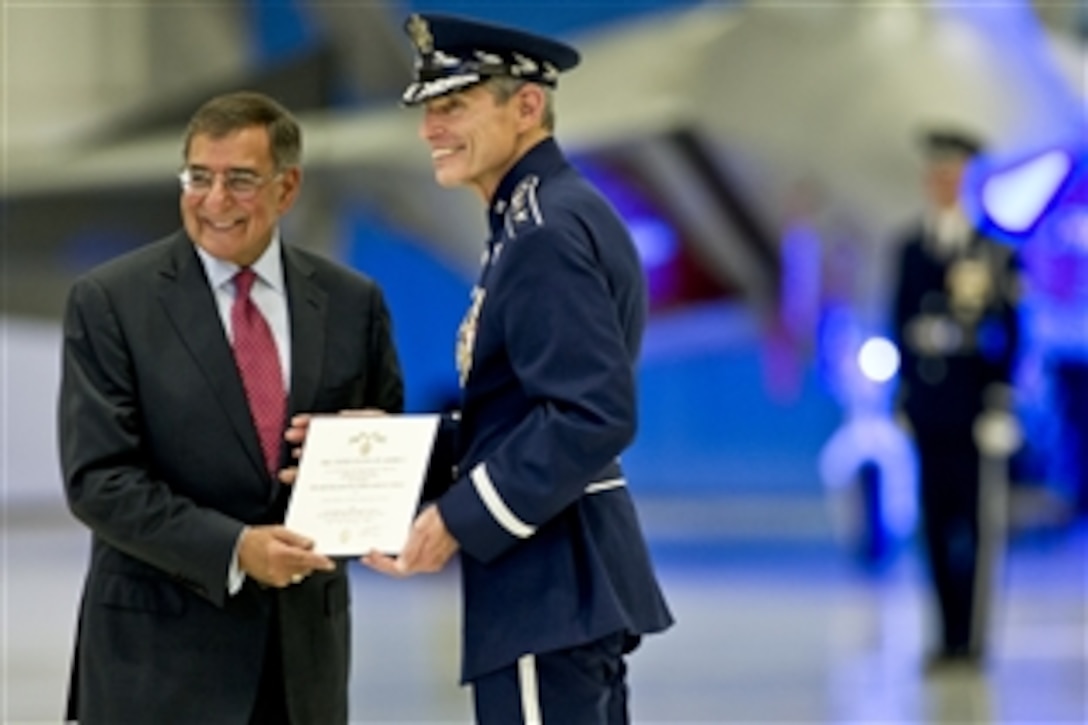 Defense Secretary Leon E. Panetta presents Air Force Chief of Staff Gen. Norton A. Schwartz with the Defense Distinguished Service Medal at the Air Force Retirement and Appointment Ceremony, where Air Force Gen. Mark A. Welsh III succeeded Schwartz as the 20th chief of staff on Joint Base Andrews, Md., Aug. 10, 2012.