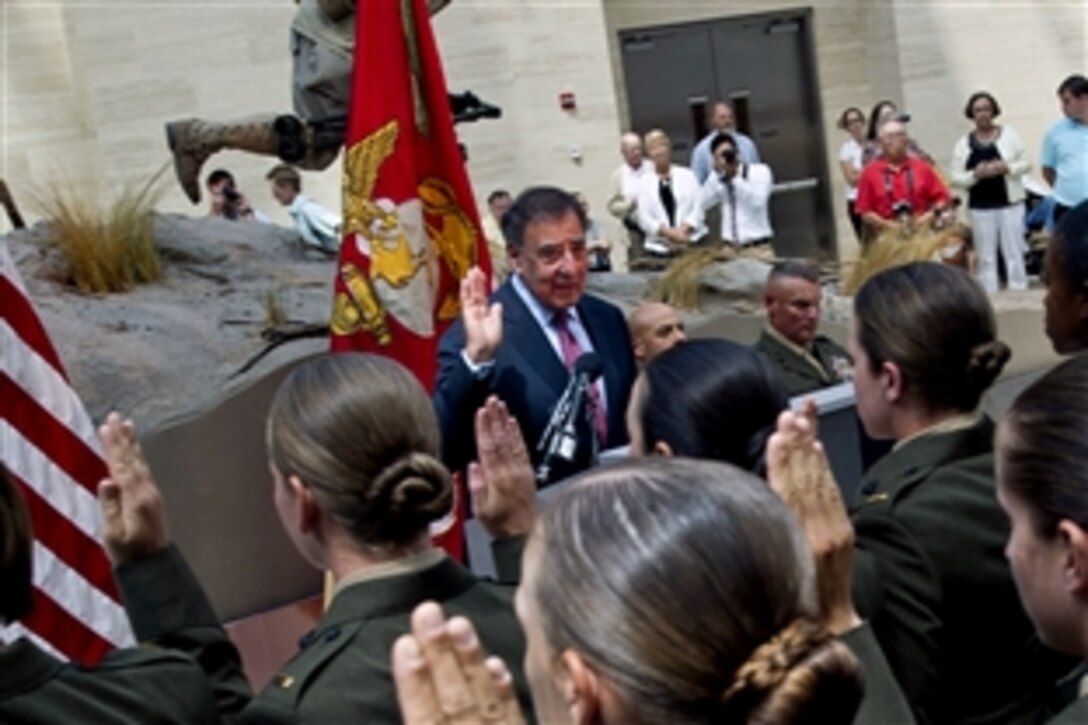Defense Secretary Leon E. Panetta administers the oath of office to newly commissioned Marine Corps 2nd lieutenants at the Marine Corps Officer Candidates School commissioning ceremony at the National Museum of the Marine Corps in Triangle, Va., Aug. 10, 2012.