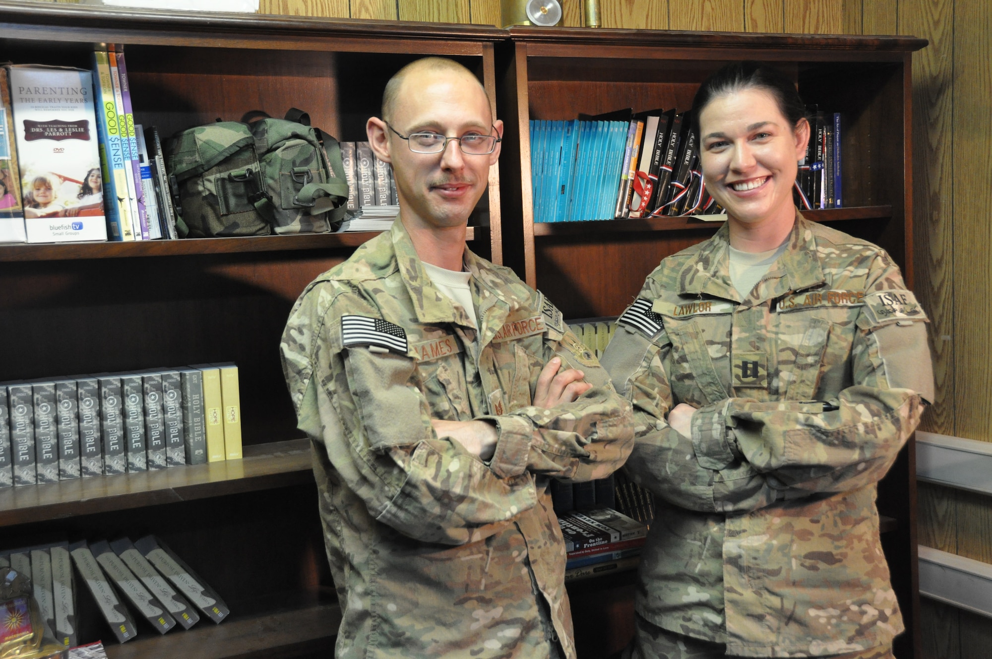 Chaplain (Capt.) Molly Lawlor (right), 455th Air Expeditionary Wing Flightline Chaplain, and TSgt Steven James, Chaplain's Assistant, regularly meet with pilots, maintainers, and support personnel between devotionals and worship services at Bagram Airfield, Afghanistan, July 29, 2012. The Chaplain Corps' Religious Support Teams provide a mission-specific "visual reminder of the holy" for various units in a deployed environment. (U.S. Air Force photo/TSgt Shawn McCowan)