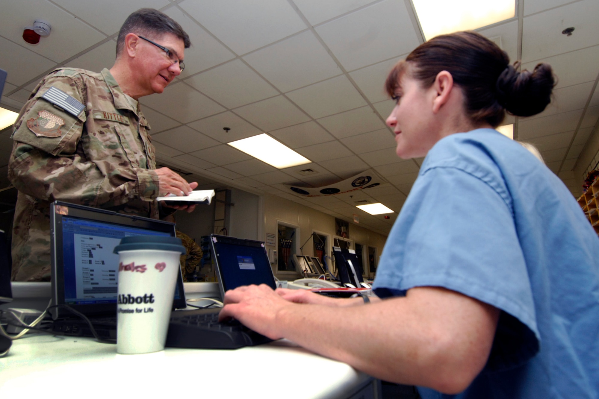 Chaplain (Maj.) Lawrence Kittle (left), Craig Joint Theater Hospital chaplain, gives spiritual encouragement to nurses at the CJTH intensive care unit at Bagram Airfield, Afghanistan, Aug. 6, 2012. Chaplains provide a unique service that promotes emotional and spiritual wellness for American servicemembers. (U.S. Air Force photo/SSgt Jeff Nevison)