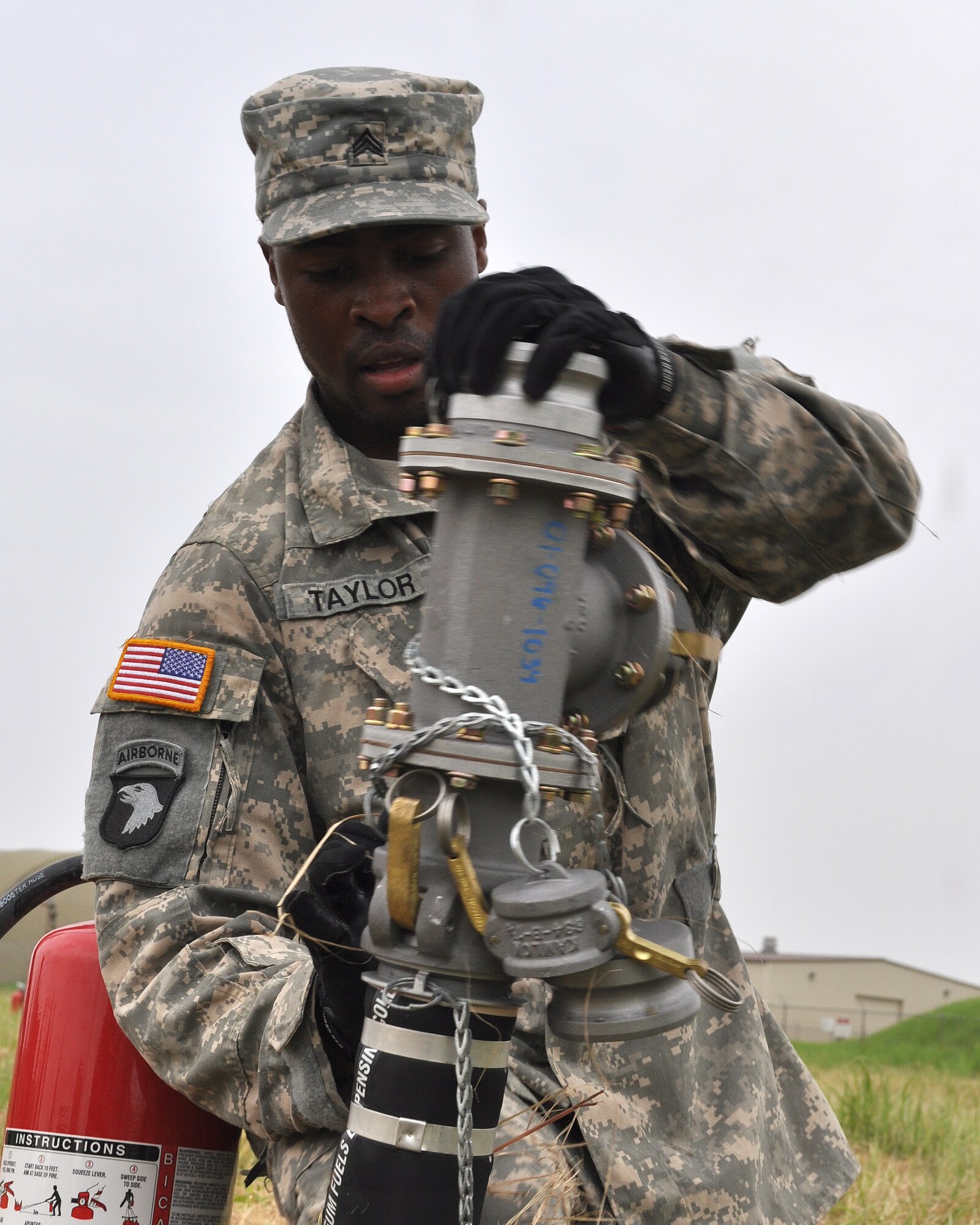 U.S. Army Sgt. Jerome Taylor, A Company 302nd Brigade Support Battalion, sets up fuel transfer piping during a competition with other U.S. Army personnel on Kunsan Air Base, Republic of Korea, Aug. 9, 2012. This was part of the first Petroleum, Oil and Lubrication Expo that is designed to demonstrate wartime capabilities of POL personnel. (U.S. Air Force photo/Staff Sgt. Jonathan Fowler) 