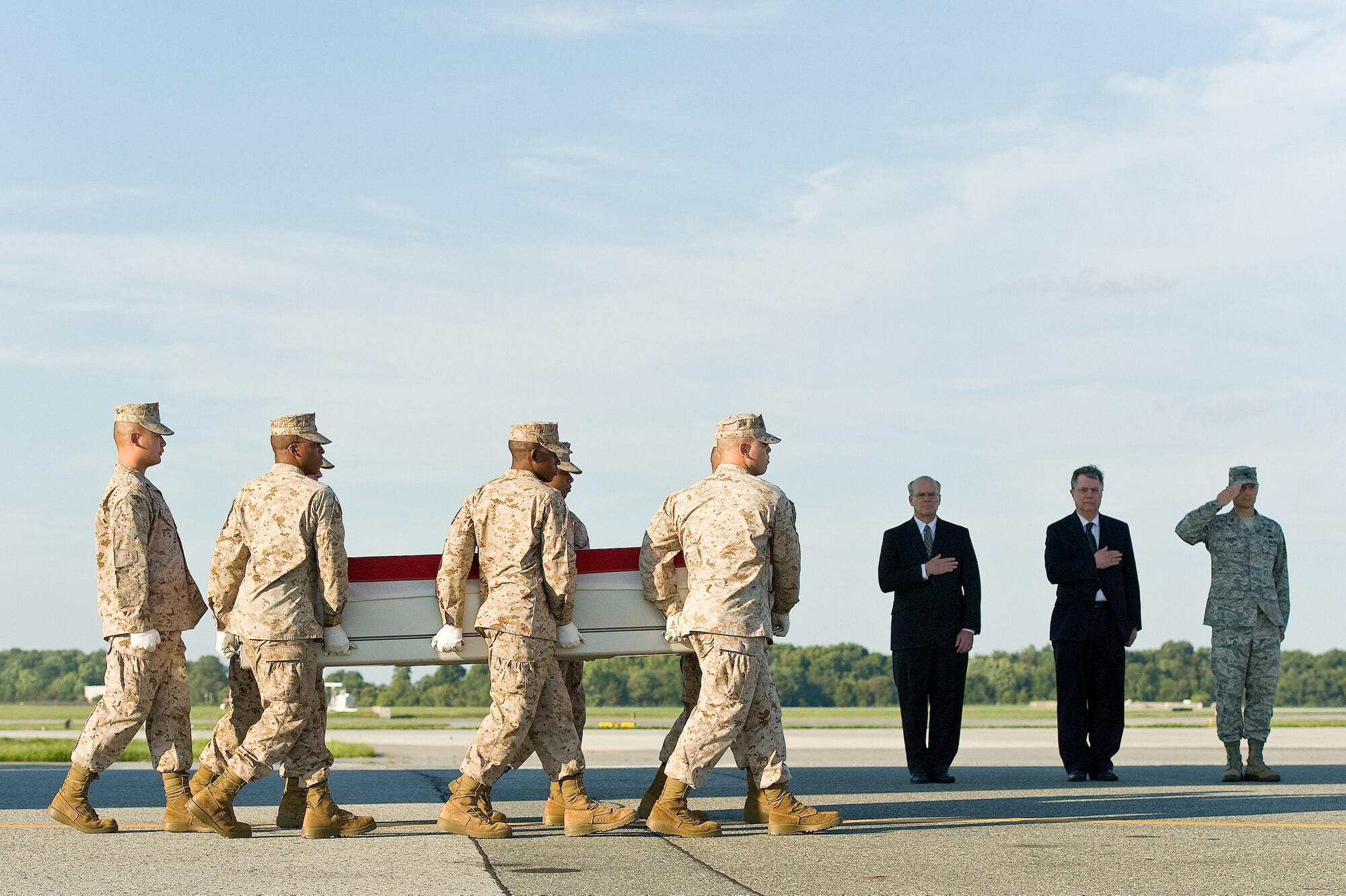 A U.S. Marine Corps carry team transfers the remains of U.S. Agency for International Development Foreign Service Officer Ragaei Abdelfattah of Annapolis, Md., at Dover Air Force Base, Del., Aug. 12, 2012. (U.S. Air Force photo/Roland Balik)