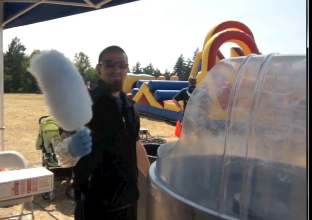 Family members and citizen airmen from the 446th Airlift Wing hours relaxing and enjoying the warm weather while participating in various activities during Family Day event here, Aug. 11. Participants could choose from activities including face painting, goldfish races, bouncy houses, static aircraft displays and a cookout.  The annual event bolsters morale and fosters unit cohesion.  (U.S. Air Force photo by Staff Sgt. Newton Nagata)