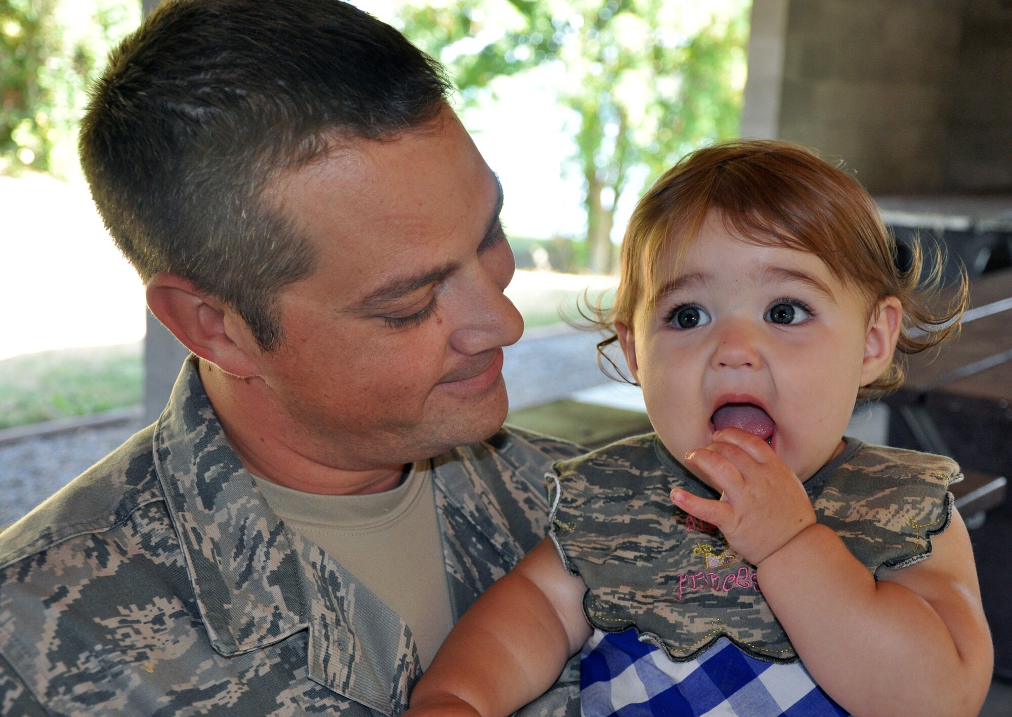 August King sports an “Air Force Princess” bib while enjoying the 446th Airlift Wing Family Day picnic here, Aug. 11.  August is the 1-year-old daughter of Reservists Tech. Sgt. Tanya King, 446th Public Affairs and Tech. Sgt. Duane King, 446th Security Forces Squadron.  (U.S. Air Force photo by Tech. Sgt. Elizabeth Moody)