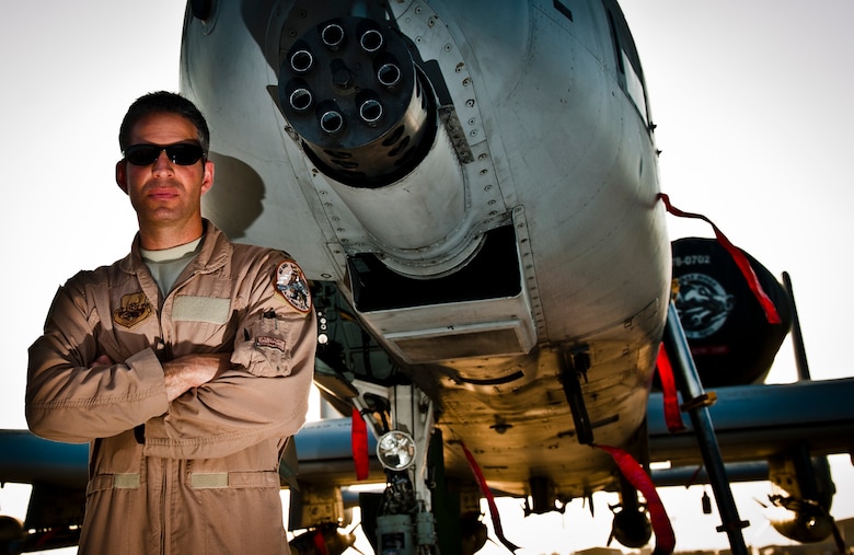 ‘Metro’, a pilot assigned to the 104th Expeditionary Fighter Squadron, stands next to a U.S. Air Force A-10 Thunderbolt II at Bagram Airfield, Afghanistan, July 7, 2012. Flying his A-10 through severe weather and difficult terrain, Metro provided life-saving close air support to ambushed coalition forces in eastern Afghanistan on June 28, 2012. (U.S. Air Force photo/Capt. Raymond Geoffroy)