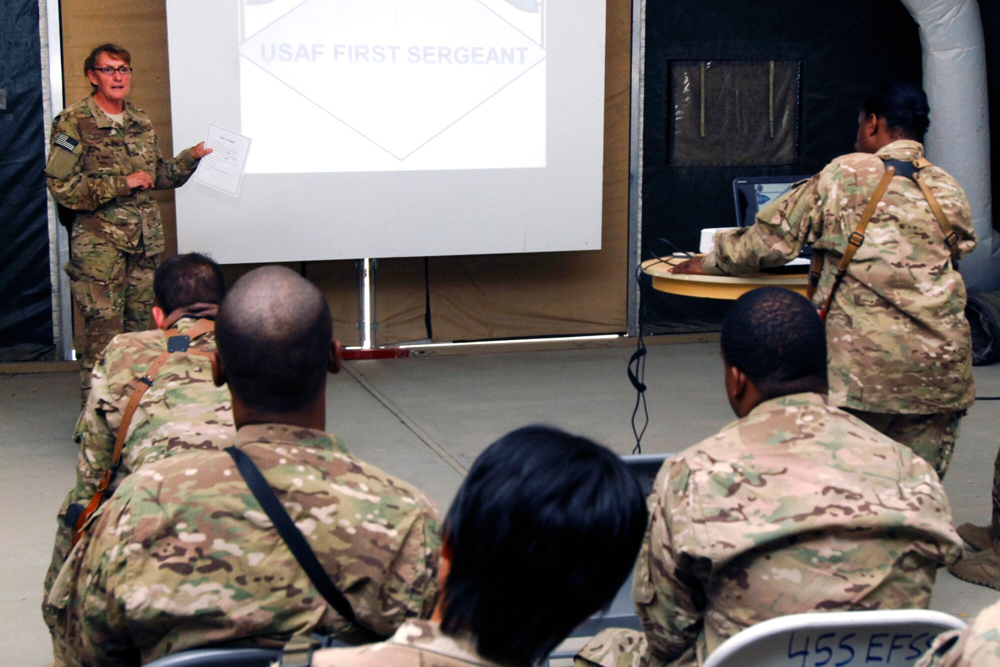 MSgt Susan Bruechert (left), 455th Expeditionary Logistics Readiness Squadron First Sergeant, speaks to a group of Master Sergeants and MSgt(sel) during a 1st Sgt symposium at Bagram Airfield, Afghanistan, Aug. 12, 2012. Bruechert spoke to Airmen interested in attending the 1st Sergeant Academy about discipline and professionalism, emphasizing both as attributes that are in line with the Air Force Core Values. She said that it’s the 1st Sgt’s who should lead by example with consistent professionalism. (U.S. Air Force photo/SSgt Jeff Nevison)