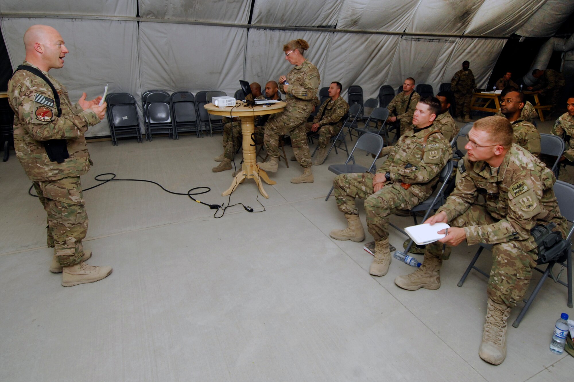 SMSgt Joseph Shelton (left), 455th Expeditionary Operations Support Squadron First Sergeant, speaks to a group of Master Sergeants and MSgt(sel) during a First Sergeant symposium at Bagram Airfield, Afghanistan, Aug. 12, 2012. Shelton spoke to Airmen interested in attending the First Sergeant Academy about the importance of the Air Force’s Family Care Plan and how it’s crucial for First Sergeants to make sure all enlisted members under them have a plan that is not only current, but logical. (U.S. Air Force photo/SSgt Jeff Nevison)