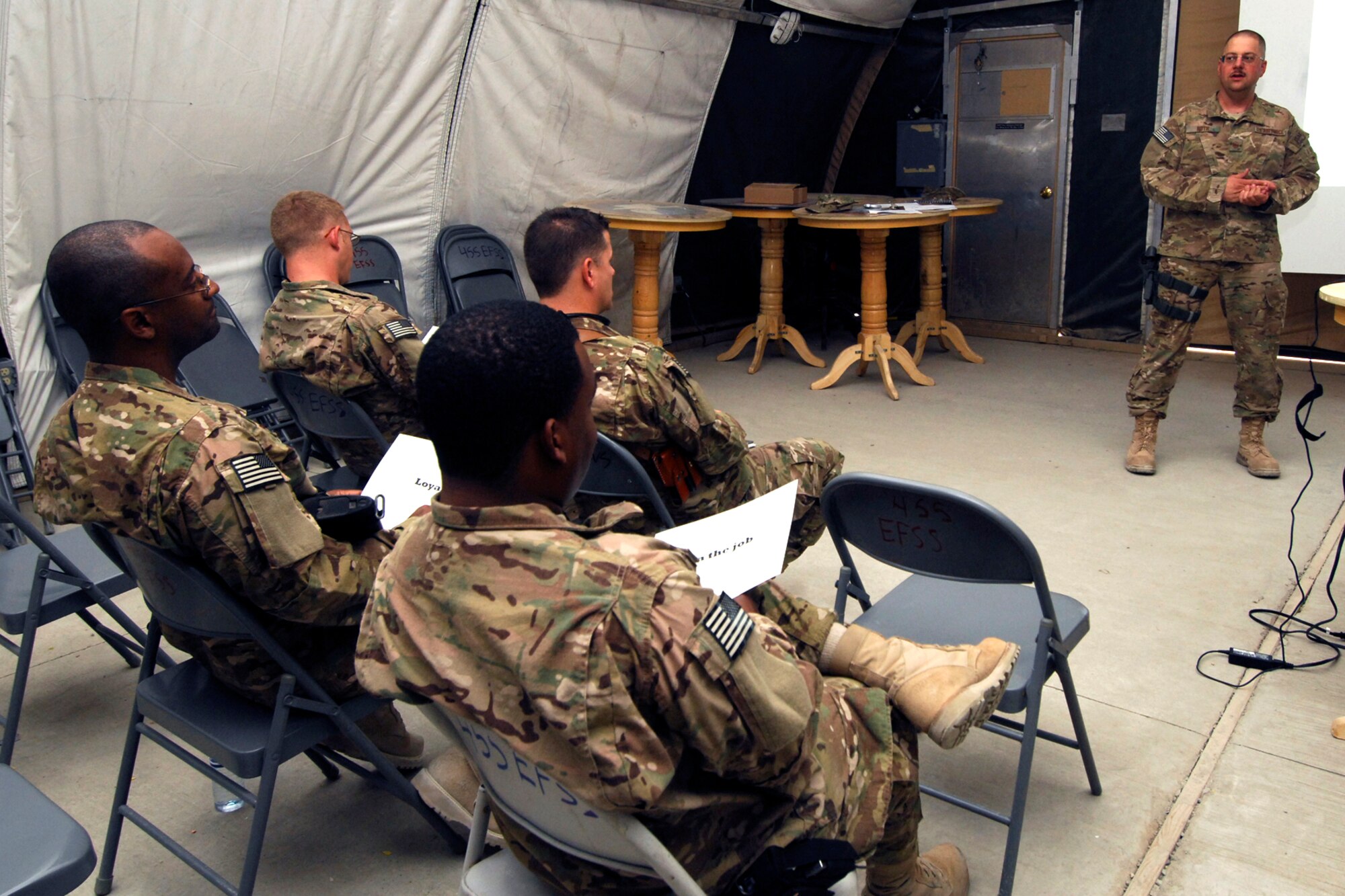 MSgt Daniel Roth (right), 455th Expeditionary Force Support Squadron First Sergeant, speaks to a group of Master Sergeants and MSgt(sel) during a First Sergeant symposium at Bagram Airfield, Afghanistan, Aug. 12, 2012. Roth Spoke to Airmen interested in attending the First Sergeant Academy about the duties and responsibilities involved with being a First Sergeant. He also spoke of the importance for First Sergeants to lead by a positive example; conducting themselves with professionalism, as younger Airmen look to them for guidance. (U.S. Air Force photo/SSgt Jeff Nevison)