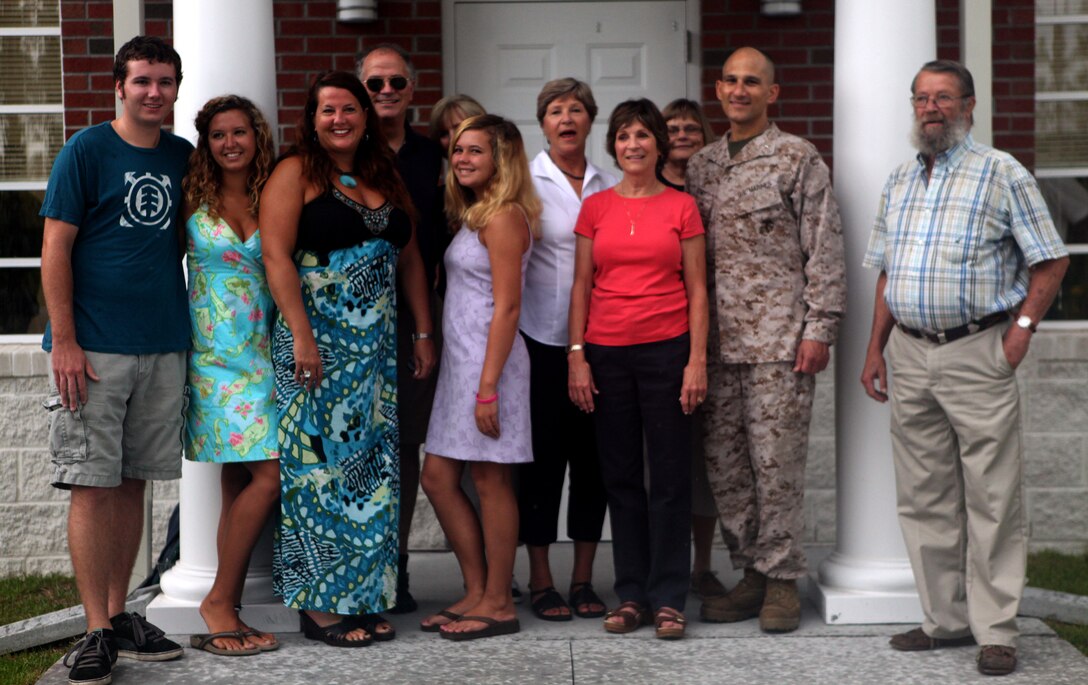 Family members of Robert McIntyre and Robert Parks gather for a picture outside the McIntyre-Parks Recreational Shooting Complex, which was named in honor of the late retired Marines, aboard Marine Corps Base Camp Lejeune Aug. 10. Family members were thrilled to have the complex named after McIntyre and Parks, who were large influencers of the sport on MCB Camp Lejeune throughout the later decades of the 1900’s.