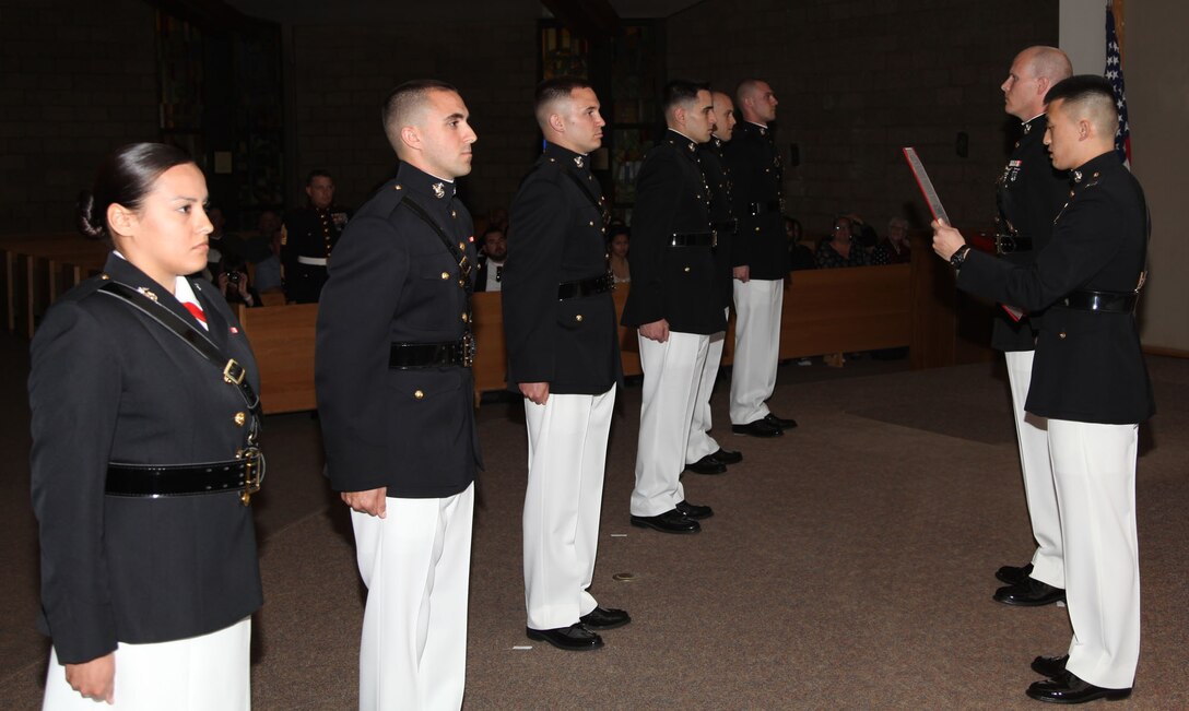 Capt. David Hankle reads the commissioning warrant for officer candidates at Marine Corps Base Camp Pendleton, Calif., April 14. The candidates, recruited out of Recruiting Station Orange County, completed Officer Candidate School and attained the rank of second lieutenant.