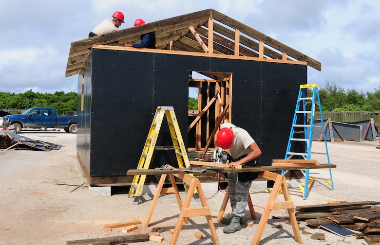 ANDERSEN AIR FORCE BASE, Guam—Members of the 554th REDHORSE Squadron frame a building during structural framing training here July 30. Members of the 554th RHS structures shop work primarily with concrete while stationed at Andersen, and framing training is used as a refresher for the Airmen. (U.S. Air Force photo by Senior Airman Benjamin Wiseman/Released)