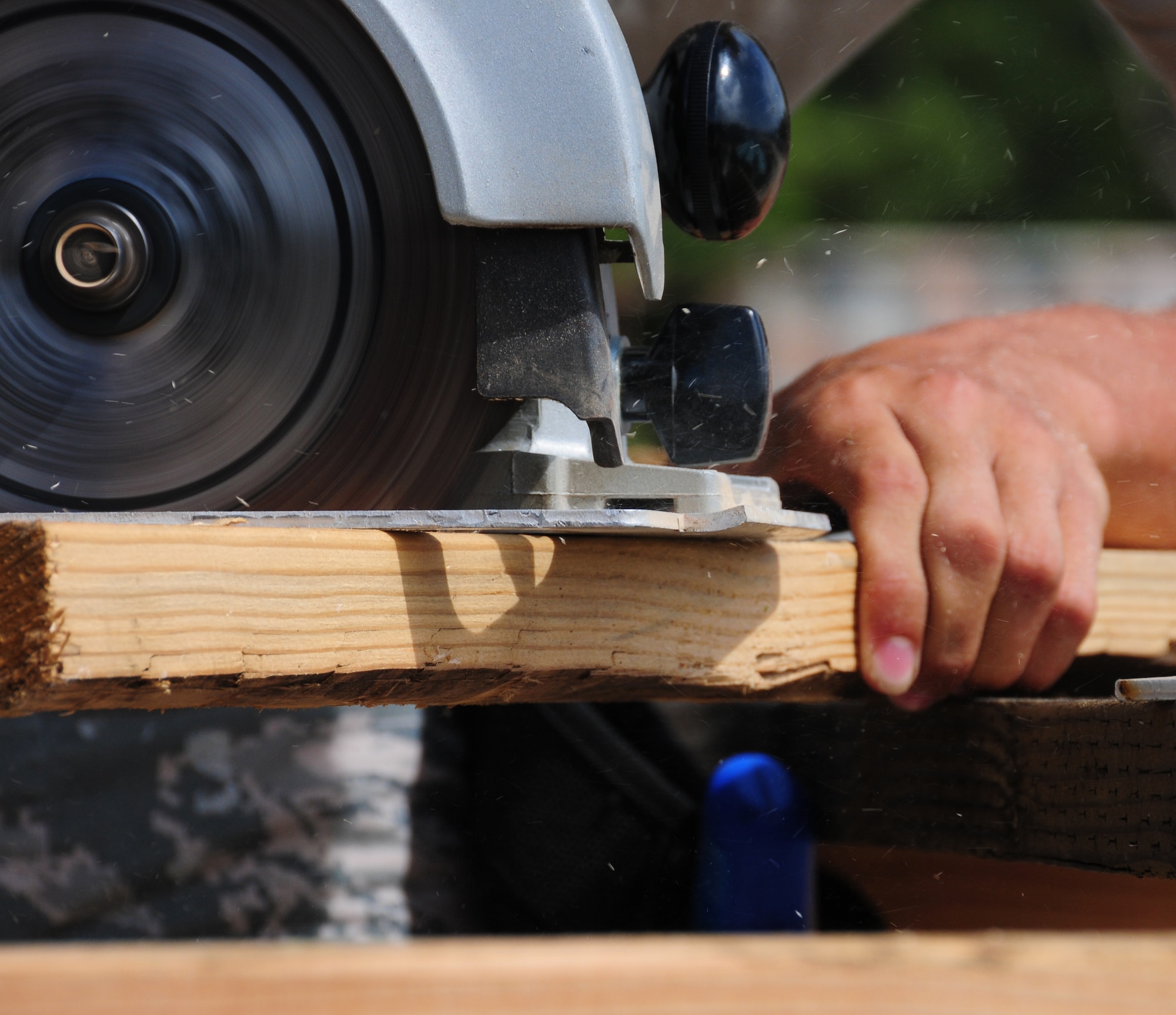 ANDERSEN AIR FORCE BASE, Guam—A member of the 554th REDHORSE Squadron uses a circular saw to cut wooden building material during structural framing training here July 30. Members of the 554th RHS structures shop work primarily with concrete while stationed at Andersen, and framing training is used as a refresher for the Airmen. (U.S. Air Force photo by Senior Airman Benjamin Wiseman/Released)