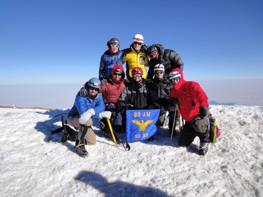 Airmen from the 10th Airlift Squadron at Joint Base Lewis-McChord, Wash., pose July 29, 2012, at the summit of Mount Rainier after a 3-day climb. (From left to right - back row) Capt. Trent Sandberg, Capt. Matt Walton, Capt. Aaron Scogin (front row) Capt. Sean Billings, Capt. Andrew Saleh, Lt. Col. Clint Zumbrunnen, Capt. Bryce Graham, Capt. Shane Hughes. (Courtesy photo)