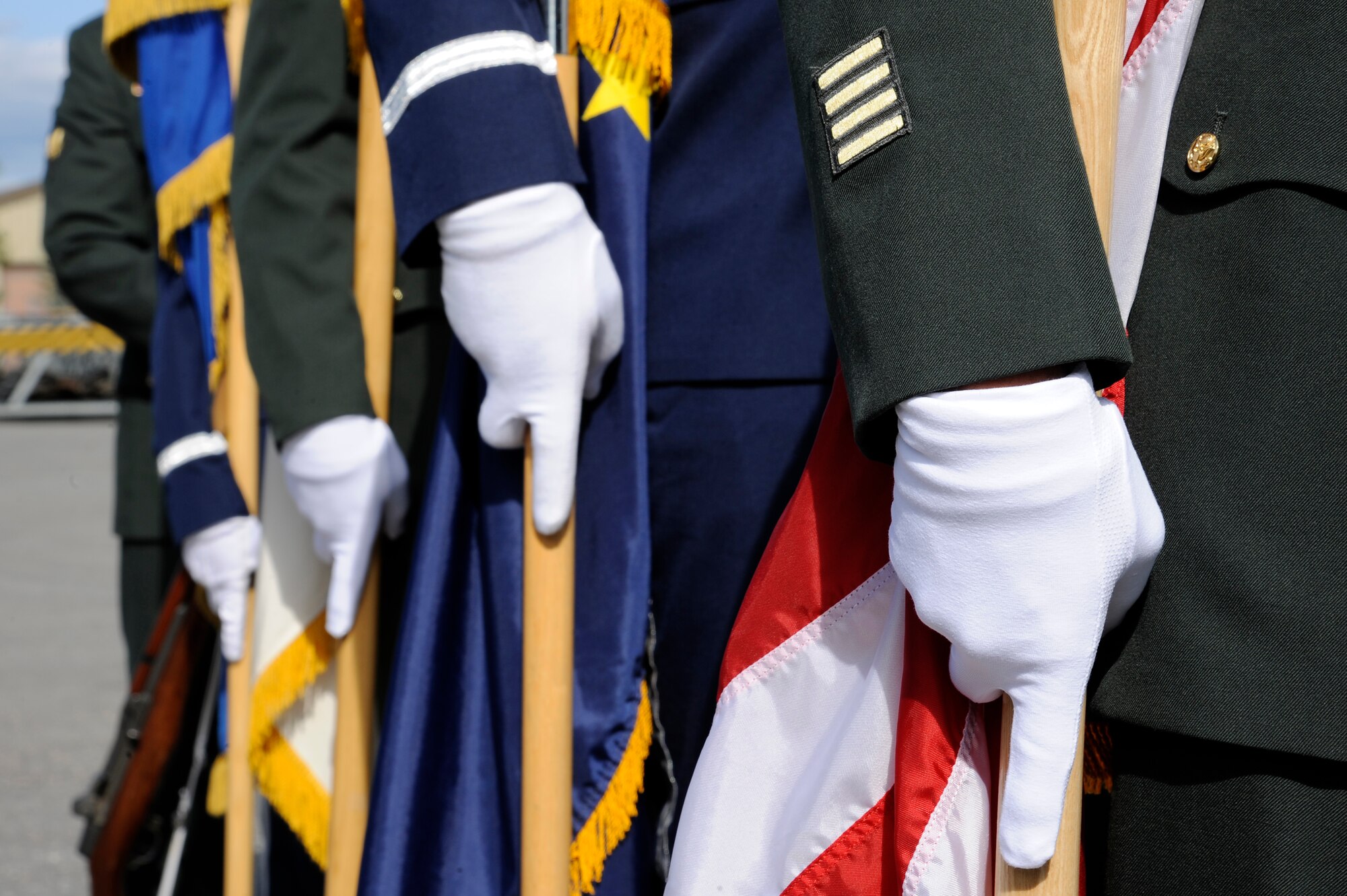 Eielson Air Force Base and Fort Wainwright honor guard members post the colors at the Stevens Joint Mobility Complex dedication ceremony Aug. 9, 2012, Eielson AFB, Alaska.  Since 2003, over 30,000 Airmen, Soldiers, Sailors and Marines have transitioned through the facility. (U.S. Air Force photo/Staff Sgt. Jim Araos)