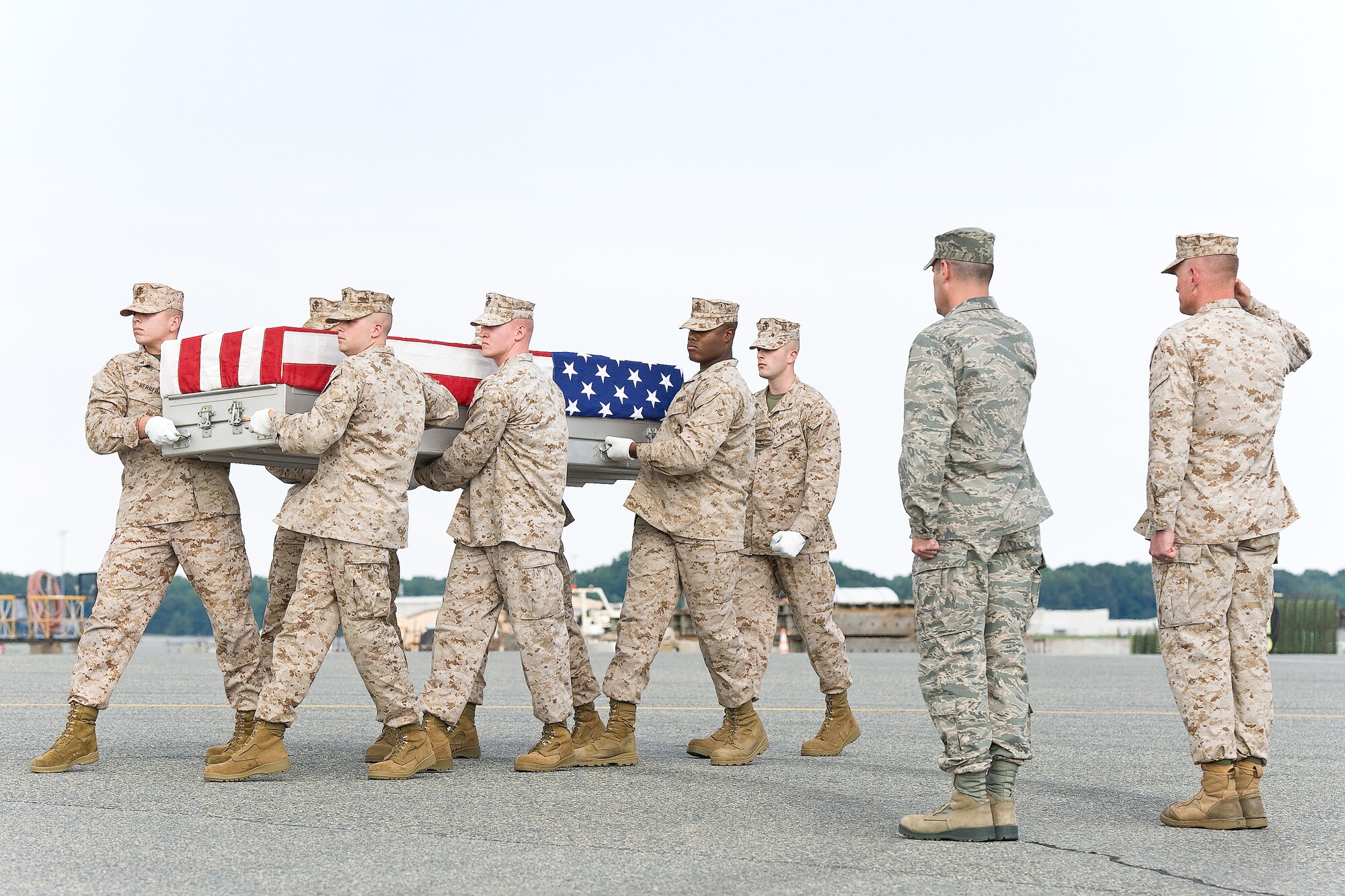 A U.S. Marine Corps carry team transfers the remains of Marine Staff Sgt. Scott E. Dickinson, of San Diego, Calif., at Dover Air Force Base, Del., Aug. 13, 2012. Dickinson was assigned to 3rd Battalion, 8th Marine Regiment, 2nd Marine Division, II Marine Expeditionary Force, Camp Lejeune, N.C. His parent command was 3rd Battalion, 3rd Marine Regiment, 3rd Marine Division, III Marine Expeditionary Force in Kaneohe Bay, Hawaii. (U.S. Air Force photo/Roland Balik)