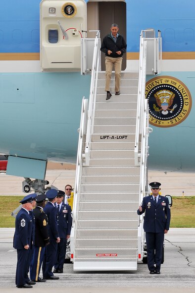 U.S. President Barack Obama steps out of Air Force One after landing at Offutt Air Force Base, Neb. Aug. 13. President Obama was welcomed by the leaders of the U.S. Strategic Command the 55th Wing. (Photo by Charles Haymond)