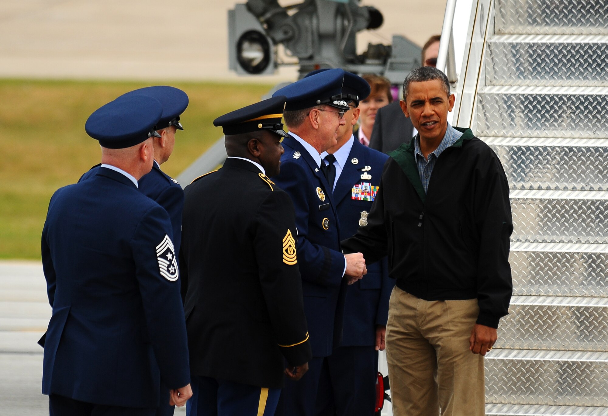 U.S. Air Force Gen. C. Robert Kehler, commander of the U.S. Strategic Command, welcomes U.S. President Barack Obama to Offutt Air Force Base, Neb., Aug. 13. President Obama made a quick stop at the base before heading to Iowa. (Photo by Josh Plueger)