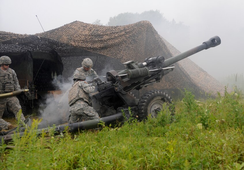 U.S. Army soldiers from the 10th Mountain Division, 3rd Battalion, 6th Field Artillery, Alpha Battery Company, 2nd platoon reload an M119 Howitzer at during exercise Mountain Peak at Fort Drum, N.Y., July 26, 2012. Mountain Peak provided more than 10,000 soldiers and Airmen an opportunity to train in a realistic combat environment before they deploy. (U.S. Air Force photo by Airman 1st Class Douglas Ellis/Released)
