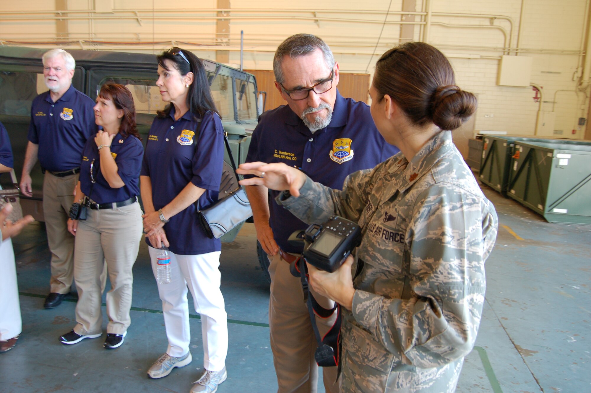Maj. Donna Hoffmeyer, 433rd Aeromedical Staging Squadron's chief of medical readiness, explains to Charles Henderson, Senior PsyCare/Senior Psychological Services, the mock medical in-processing patient line at Joint Base San Antonio-Lackland, Texas, August 10, 2012. The Honorary Commanders Program partners local civic and business leaders with wing senior leadership to learn more about the wing's diverse missions.  In turn, honorary commanders share what they learn with their varied, equally-diverse audiences.  The other honorary commanders shown here are Mark Frye, Port San Antonio,  Kathy Phoenix, VITAS, Hon. Marialyn Barnard, Fourth Court of Appeals. (U.S. Air Force Photo/Elsa Martinez)
