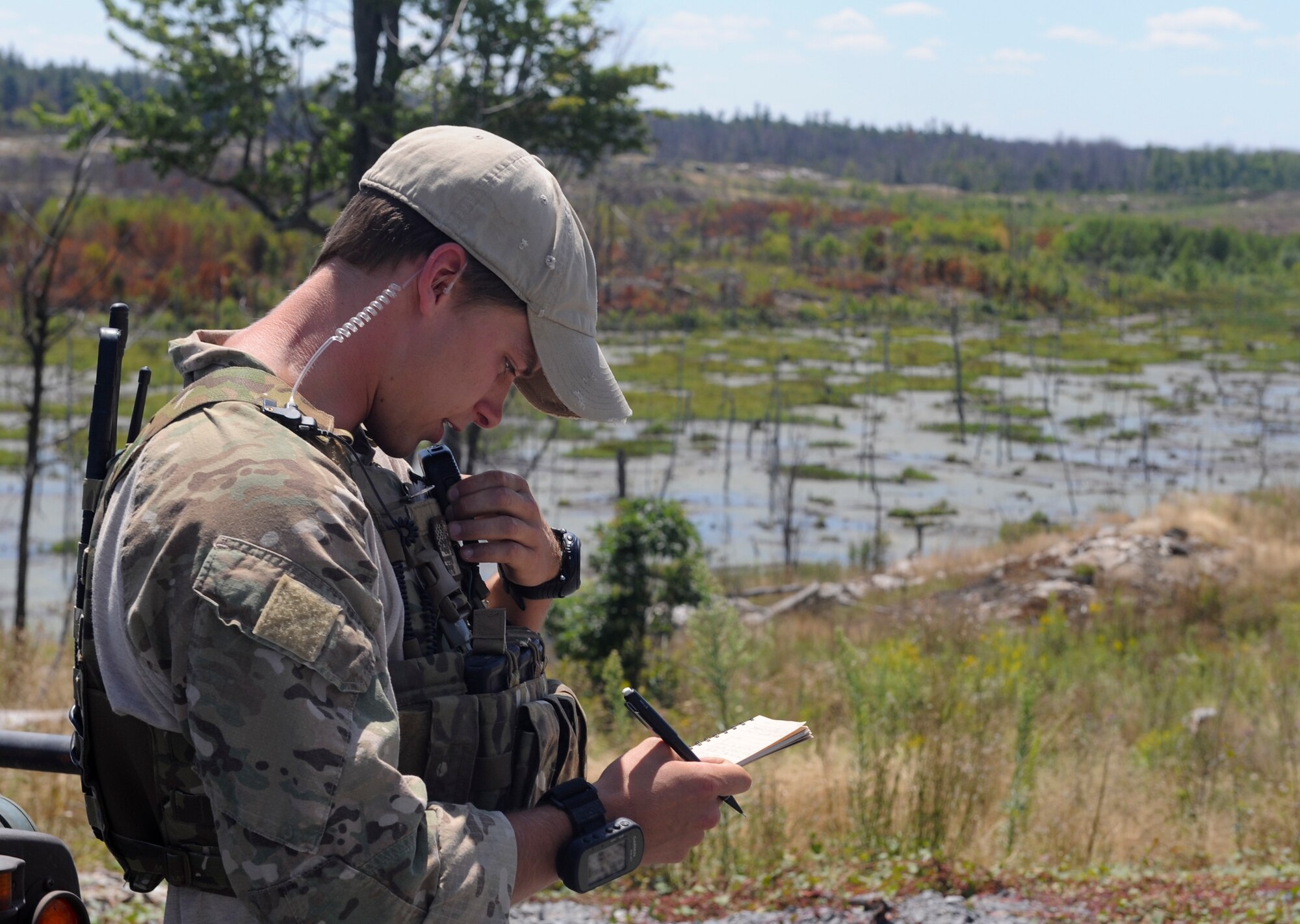 U.S. Air Force Senior Airman Jeremiah Osborn, 20th Air Support Operations Squadron joint terminal attack controller, communicates with aircraft during exercise Mountain Peak at Fort Drum, N.Y., July 29, 2012. During Mountain Peak, JTACs ensured aircraft were clear of artillery fire. (U.S. Air Force photo by Airman 1st Class Douglas Ellis/Released)
