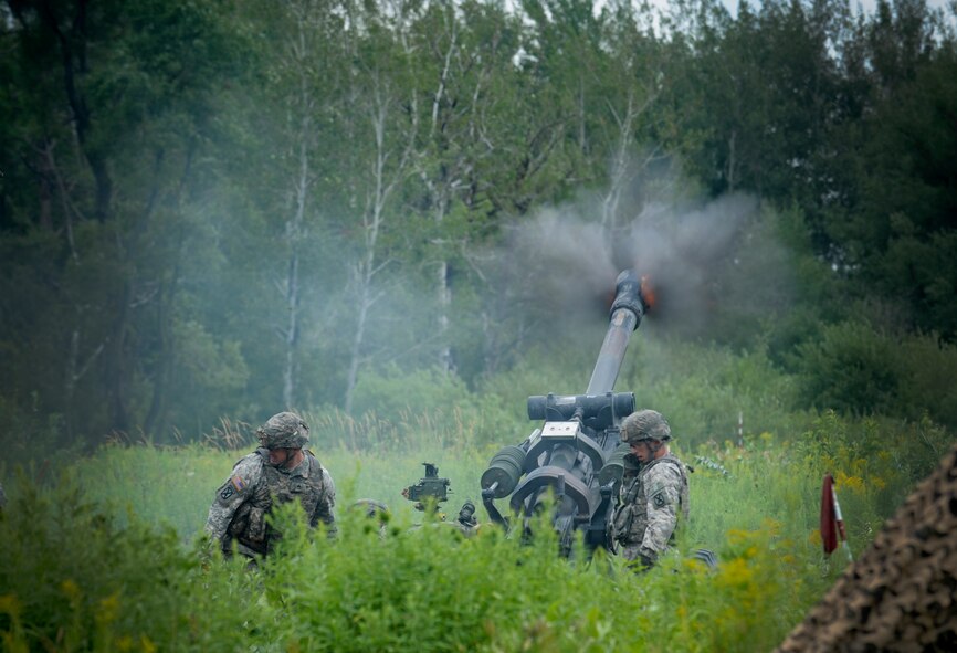 U.S. Army soldiers from the 10th Mountain Division, 3rd Battalion, 6th Field Artillery, Alpha Battery Company, 2nd platoon fire an M119 Howitzer at Fort Drum, N.Y., July 26, 2012. The M119 is a light weight and air droppable with an average crew of seven soldiers. (U.S. Air Force photo by Airman 1st Class Douglas Ellis/Released)

