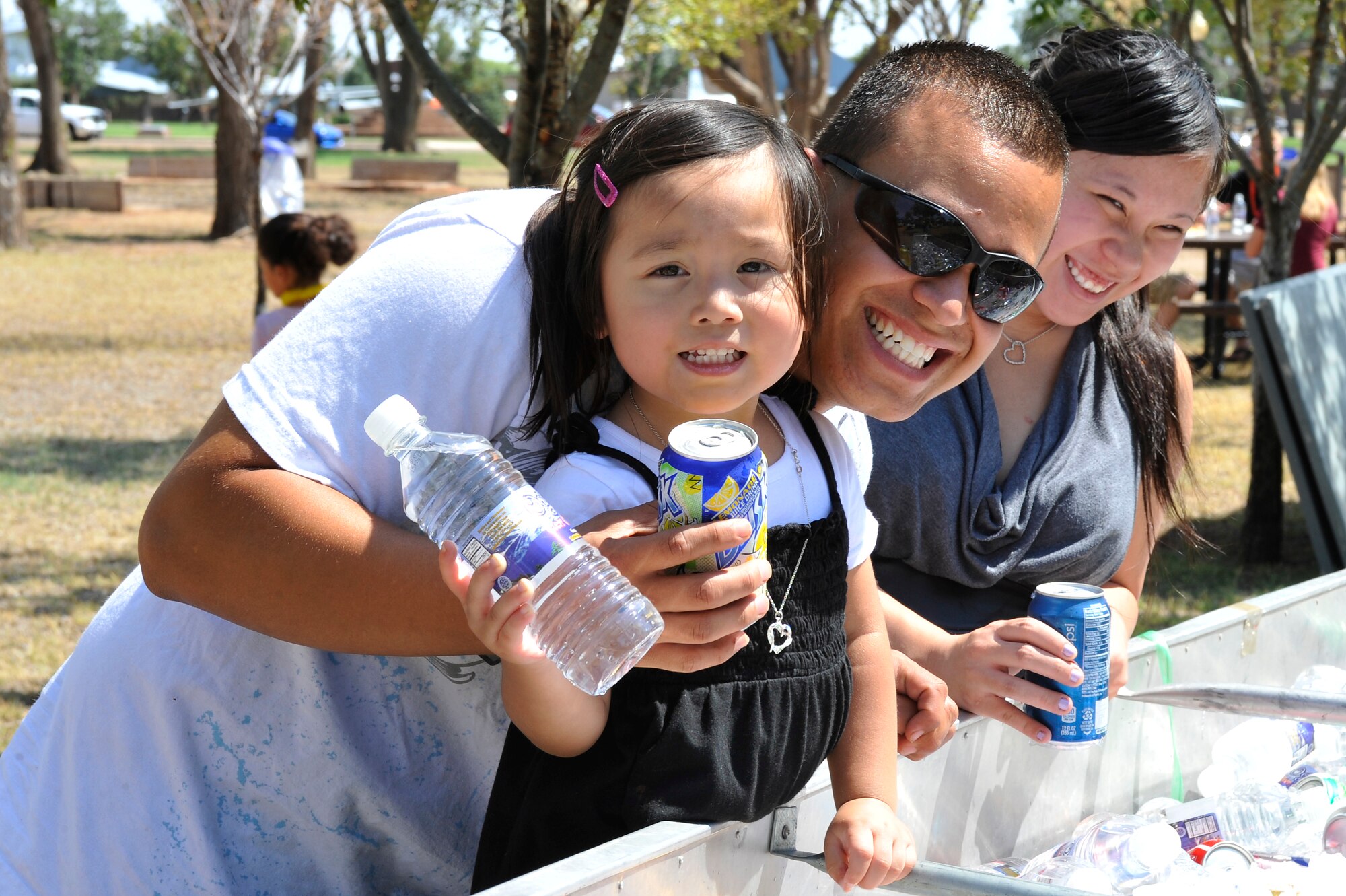 A family enjoys themselves during Cannon Appreciation Day at Cannon Air Force Base, N.M., Aug. 10, 2012. The Clovis/Curry County Chamber of Commerce, Committee of Fifty, Military Affairs Committee and the Clovis Industrial Development Corporation came together to sponsor the event for members of the Cannon community. (U.S. Air Force photo/by Airman 1st Class Ericka Engblom)