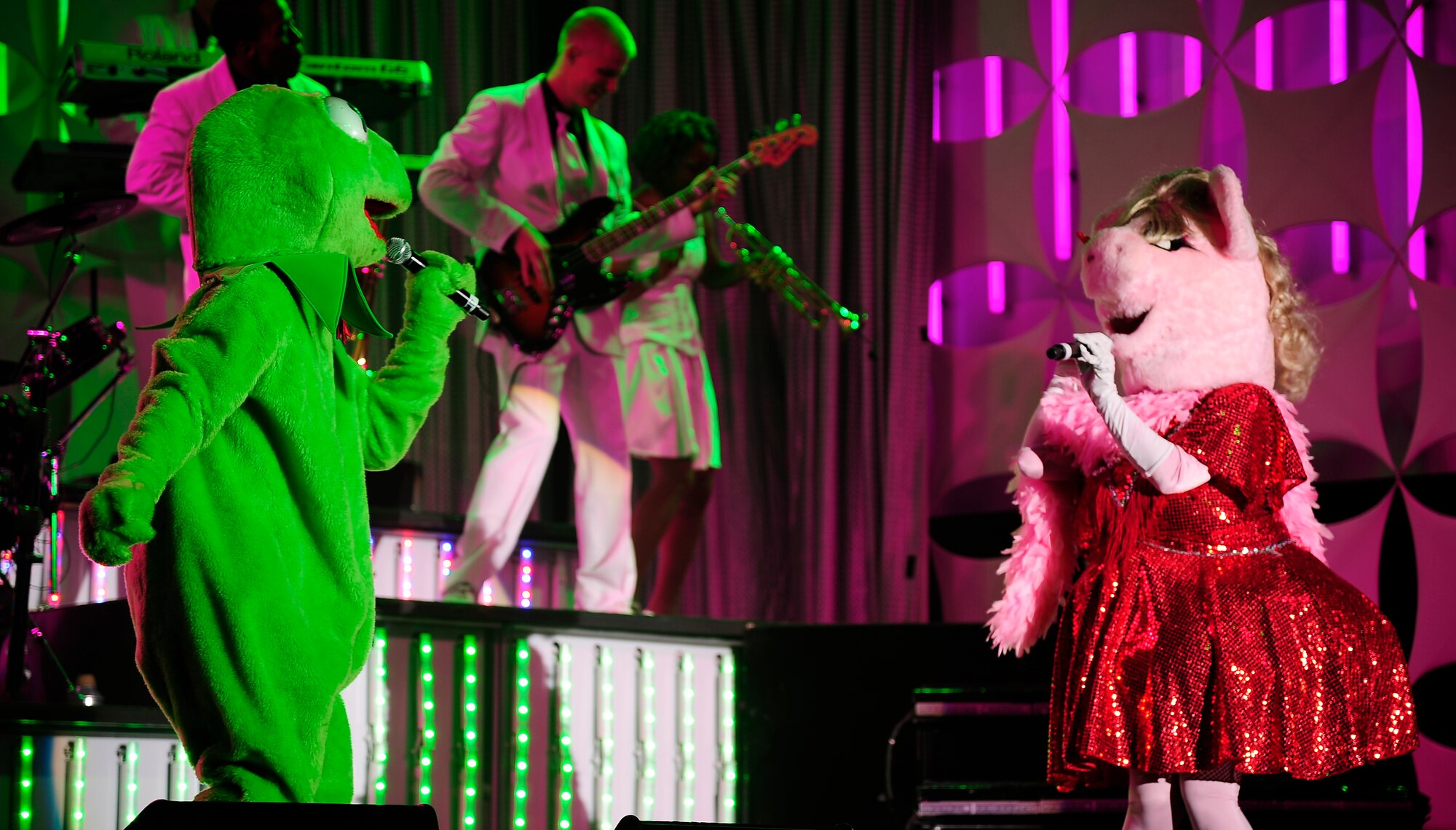Kermit and Miss Piggy surprise the audience during a Tops In Blue performance at the University of Central Missouri in Warrensburg, Mo., Aug. 9, 2012. The two hour concert was targeted for Whiteman Air Force Base service members and their families, but fans from the local communities were welcome also. Tops In Blue travel throughout the United States and to more than 20 countries during their 10-month tour each year. (U.S. Air Force photo/Senior Airman Cody H. Ramirez)