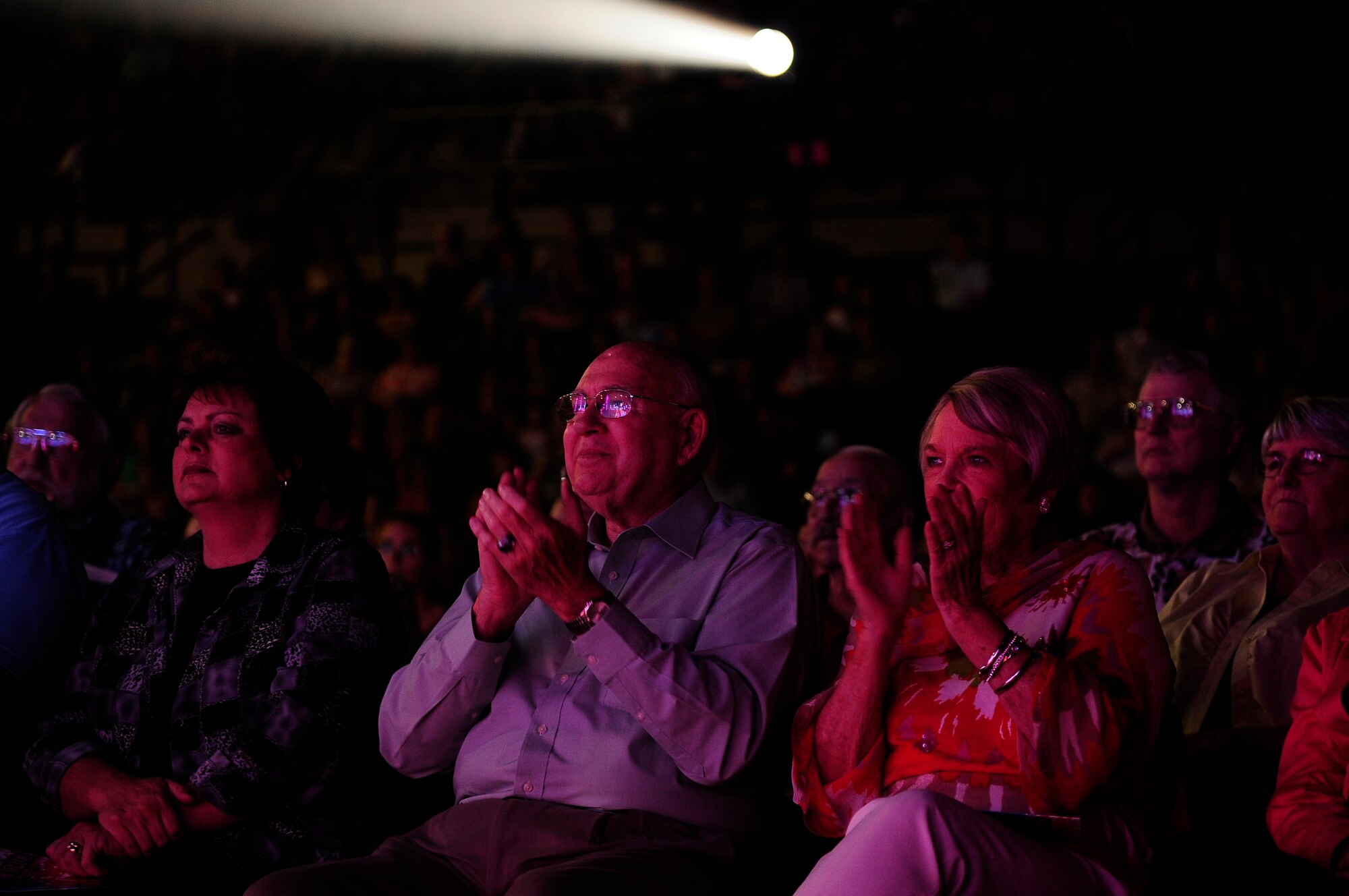 Fans clap pleased with their front-row seating at a Tops In Blue performance at the University of Central Missouri in Warrensburg, Mo., Aug. 9, 2012. The two hour concert was targeted for Whiteman Air Force Base service members and their families, but fans from the local communities were welcome also.  (U.S. Air Force photo/Senior Airman Cody H. Ramirez)