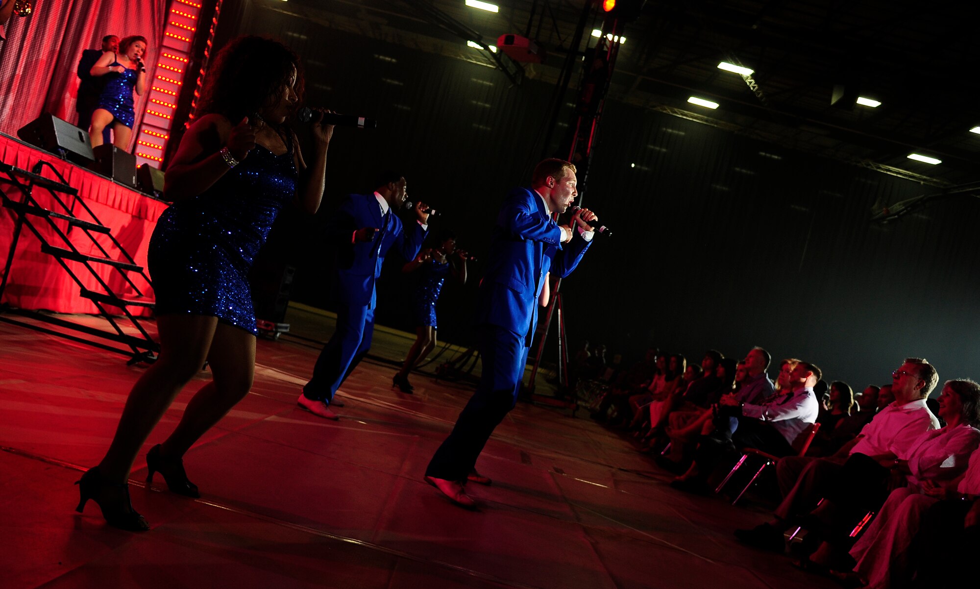 Hundreds of fans from Whiteman Air Force Base and the local area watch Tops In Blue perform at the University of Central Missouri in Warrensburg, Mo., Aug. 9, 2012. Tops In Blue travel throughout the United States and to more than 20 countries during their 10-month tour each year. (U.S. Air Force photo/Senior Airman Cody H. Ramirez)