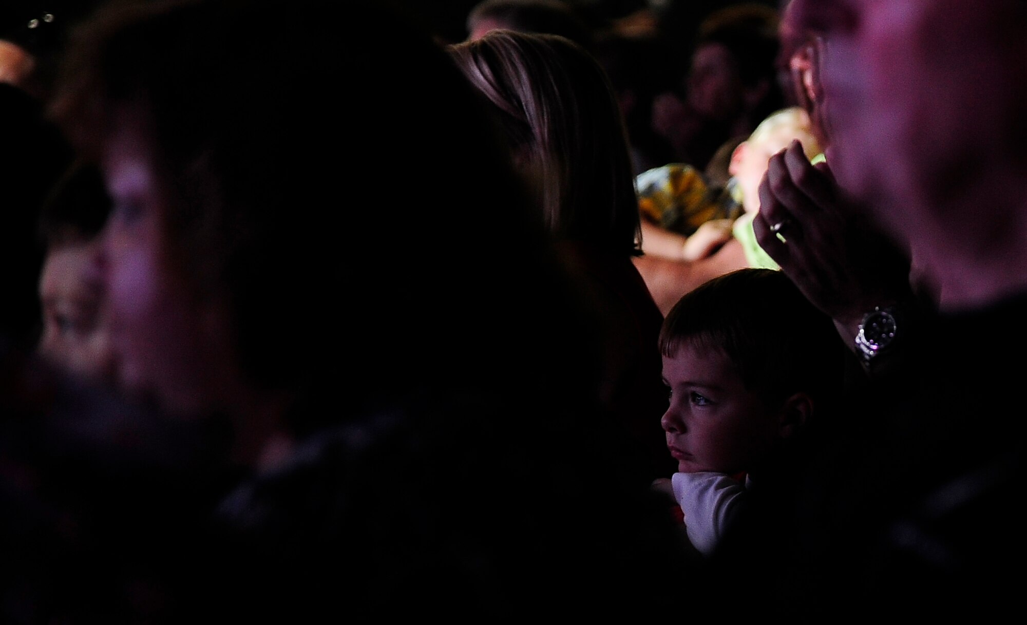 A young spectator is entranced by a Tops In Blue performance at the University of Central Missouri Aug. 9, 2012. Tops In Blue provided free entertainment for Whiteman Air Force Base service members and their families, and for fans in the local community. (U.S. Air Force photo/Senior Airman Cody H. Ramirez)