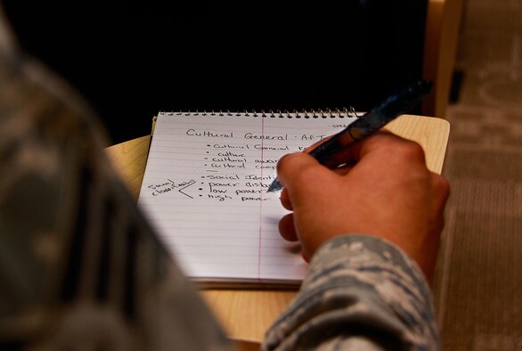 Senior Airman Anthony Svetz, 911th Airlift Wing Maintenance Squadron aerospace ground equipment technician, keeps notes as Tech. Sgt. Aazita Afshari teaches Cultural General as part of a blocked ancillary training for the Academic Unit Training Assembly at the 911th AW, Aug. 11, 2012. During this training, Airmen are able to accomplish nine computer based training requirements in a four hour time frame. The Academic UTA benefits the Airmen by condensing the online classes into a constructive teaching and learning opportunity for Airmen on base. (U.S Air Force photo by Senior Airman Justyne Obeldobel/Released)
