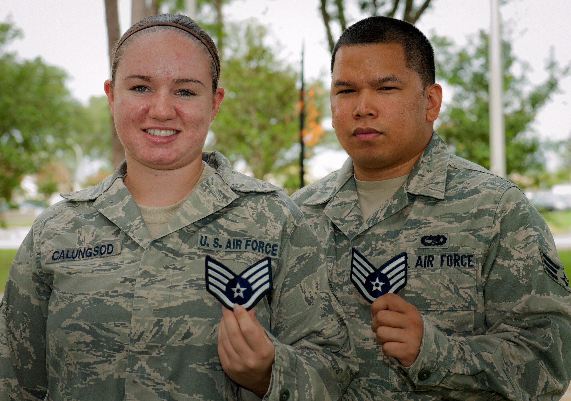 Senior Airmen Joseph and Nicole Calungsod, a married couple in the 33rd Fighter Wing, were both selected for promotion to staff sergeant on their first try. The couple is in the same career field and work in the same unit, the 33rd Maintenance Squadron. They will sew on the new non-commissioned officer stripe just after they have their first child. (U.S. Air Force photo/Samuel King Jr.)
