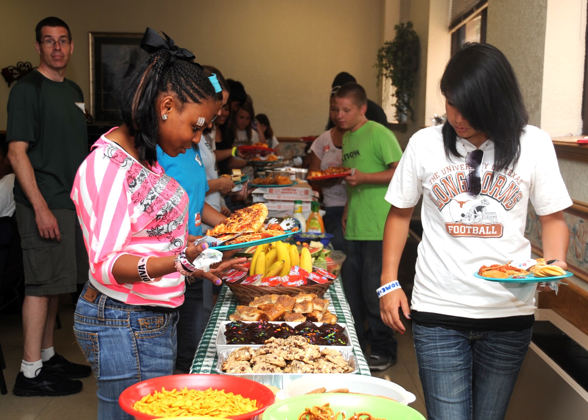 ALTUS AIR FORCE BASE, Okla. – Children from the Tipton Children’s Home eat lunch at the base chapel during the Christmas in August event Aug. 11, 2012. The children were visiting Altus AFB and received gifts from the chapel and other organizations from the base. (U.S. Air Force photo by Airman 1st Class Franklin R. Ramos / 97th Air Mobility Wing / Released)