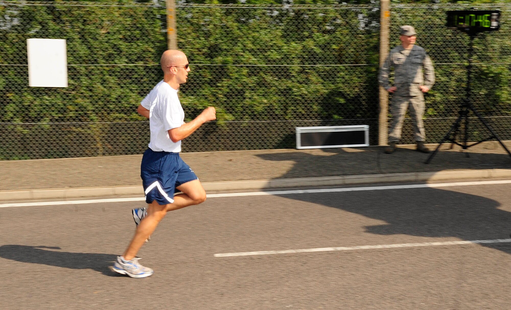 RAF MILDENHALL, England – Larry Hagdorn, 100th Comptroller Squadron, sprints out the last few yards of the Team Mildenhall 5K Run at RAF Mildenhall Aug. 10, 2012.  Hagdorn took third place out of the male runners in the monthly run. (U.S. Air Force photo/Senior Airman Ethan Morgan)