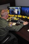 Lt. Col. Jenns Robertson, Air and Space Power Strategist at the Air Force
Research Institute, works on Theater History of Operations at Maxwell Air Force Base, August 2. THOR is database of bombs dropped from American military aircraft from World War One through current times. (U.S. Air Force photo by Airman 1st Class William Blankenship) 
