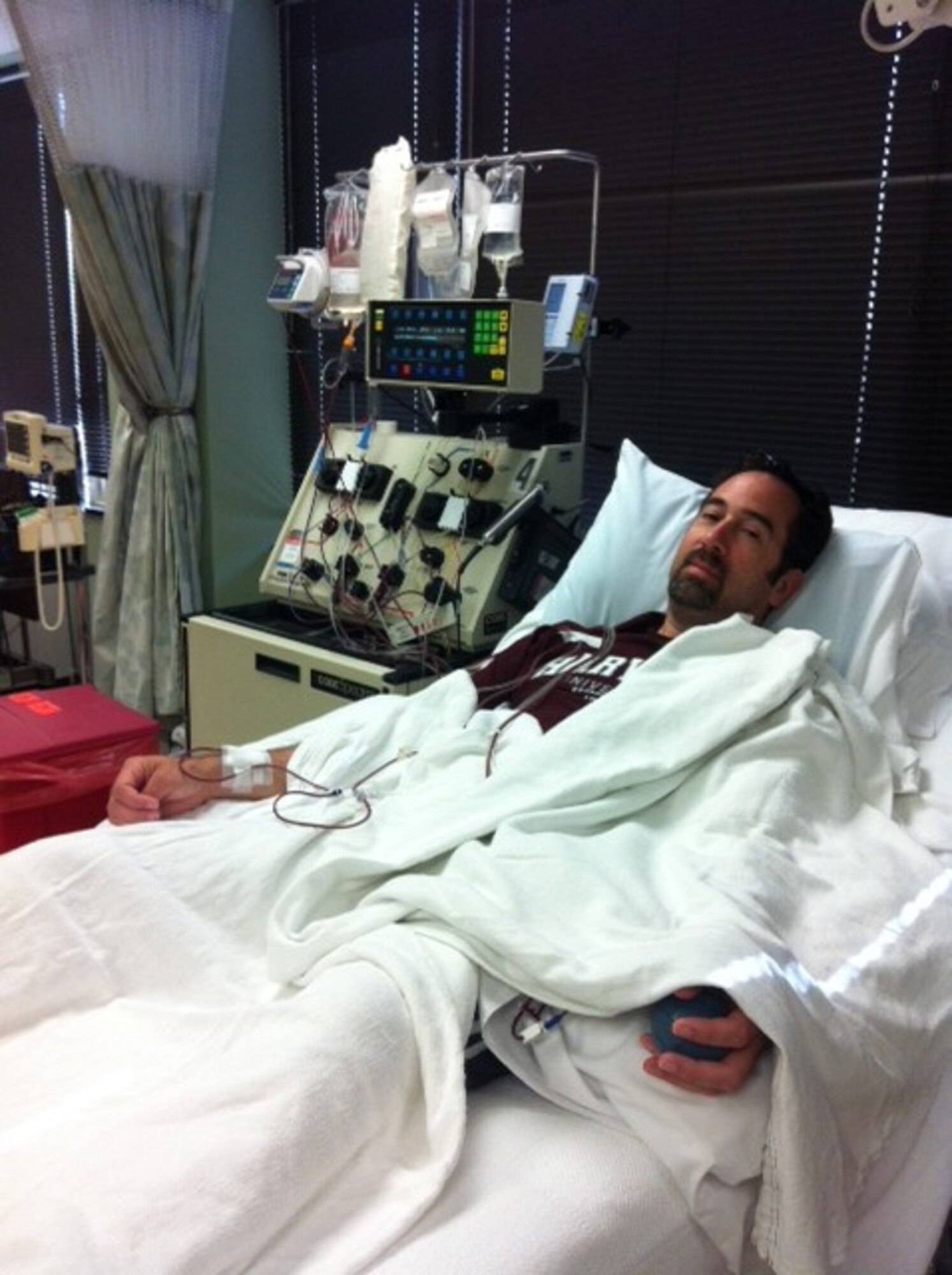 Paul J. Firman, a retired senior master sergeant who works at the Air Force Negotiation Center of Excellence, provides a peripheral blood stem cell donation in Washington, D.C. The donation went to an anonymous patient in Italy as part of the Department of Defense Marrow Donor Program. (Contributed photo)