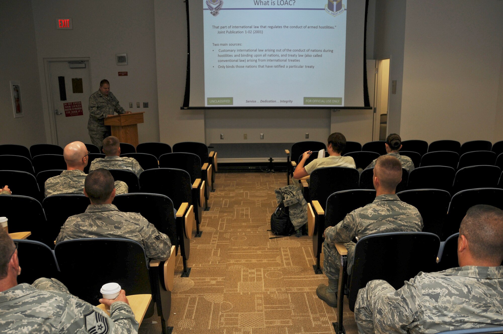 Airmen assigned to the 911th Airlift Wing are briefed on the mandatory bi-annual law of armed conflict training during the academic unit training assembly at the 911th Airlift Wing, Aug. 11, 2012. The law of armed conflict is instructed to minimize the amount of damage and suffering caused by war. It also aims to protect civilians, prisoners of war, the wounded, sick, and shipwrecked. (U.S. Air Force photo by Senior Airman Joshua J. Seybert/Released)
