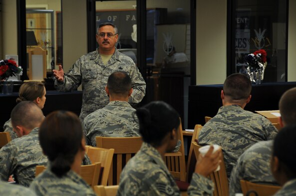Chief Master Sgt. John Payne, the 911th Airlift Wing command chief, talks to junior enlisted Airmen assigned to the 911th AW during an enlisted call held at the dining facility, Aug. 11, 2012. Chief Payne spoke to the Airmen about a variety of topics including the importance of military and civilian education as well as the new Department of Defense law stating that reservists can be deployed to natural disaster areas. He also stressed the importance of getting to know our fellow Airmen and being good Wingmen. (U.S. Air Force photo by Senior Airman Joshua J. Seybert)