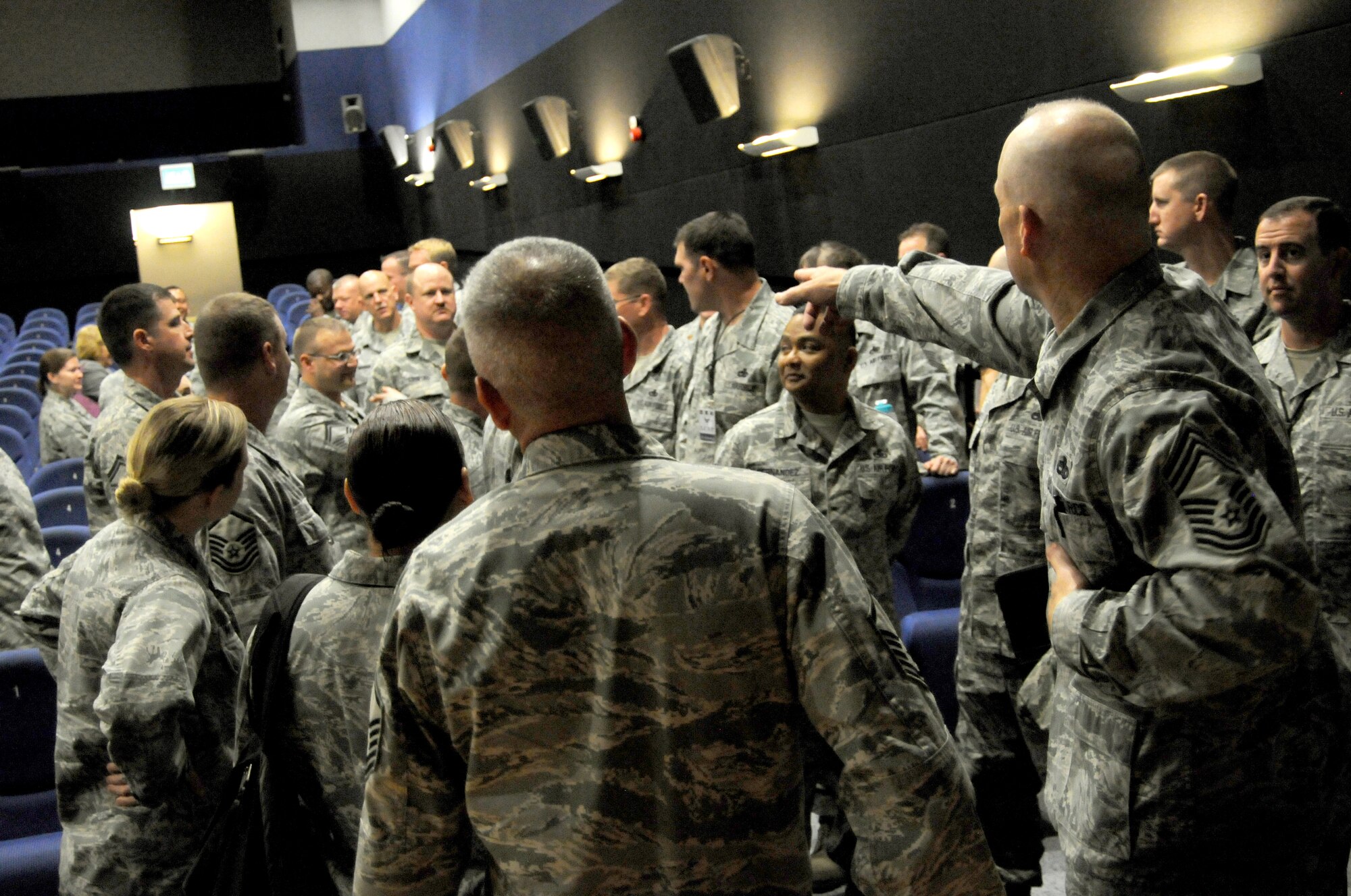 RAF MILDENHALL, England – Chief Master Sgt. William Lee, 100th Maintenance Group, introduces members of Team Mildenhall to Logistics Compliance Assessment Program inspectors following the LCAP in-brief Aug. 13, 2012, at the RAF Mildenhall base theater. The 100th MXG prepared for the inspection by critically reviewing all of their checklists in order to verify compliance with all requirements. (U.S. Air Force photo/Tech. Sgt. Neal X. Joiner)