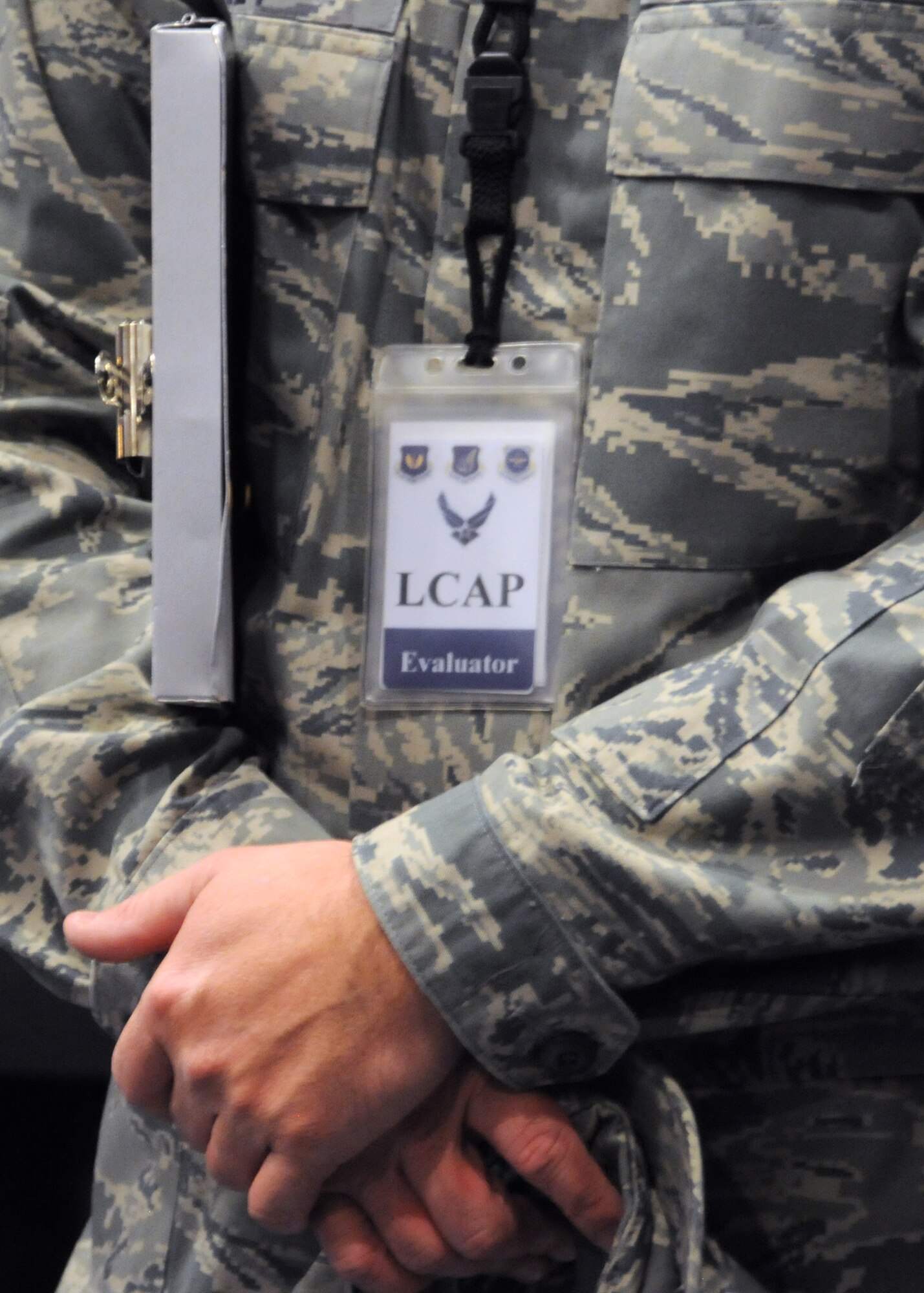 RAF MILDENHALL, England – A Logistics Compliance Assessment Program inspector stands following the Team Mildenhall LCAP inspection in-brief Aug. 13, 2012, in the RAF Mildenhall base theater. The Air Mobility Command inspection ensures Team Mildenhall is following regulations, Air Force instructions, policies and procedures correctly. (U.S. Air Force photo/Tech. Sgt. Neal X. Joiner)
