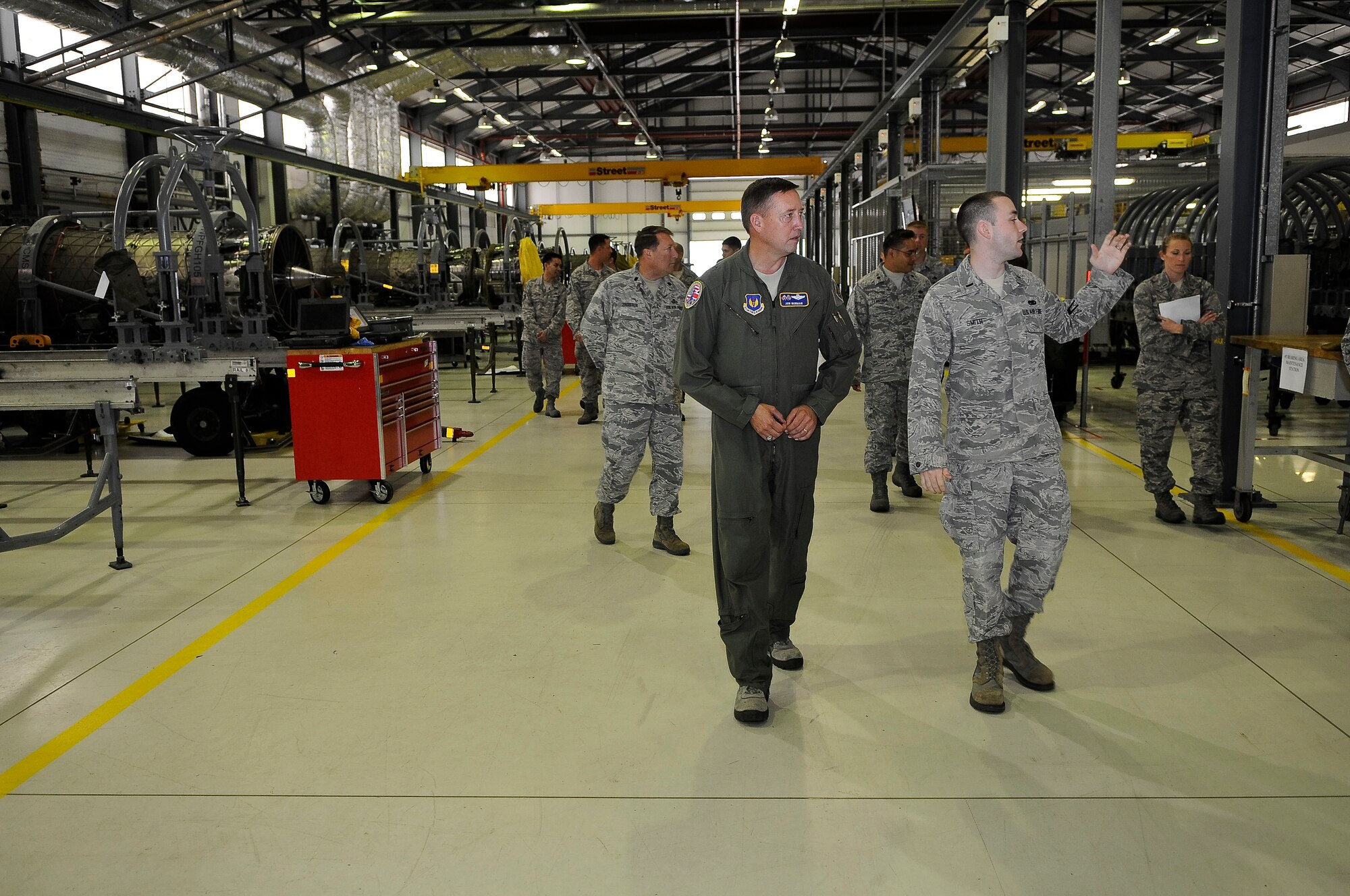 ROYAL AIR FORCE LAKENHEATH, England -- 1st Lt. Erik Smith, 48th Component Maintenance Squadron officer in charge, shows Brig. Gen. Jon Norman, Director, United States Air Forces in Europe-United Kingdom, different areas of the 48th CMS Jet Engine Propulsion Facility, during his visit of the 48th Fighter Wing Aug. 9, 2012. Norman toured the 48th Maintenance Group, 48th Medical Group and various locations around RAF Lakenheath.  (U.S. Air Force photo by Senior Airman Connor Estes)
