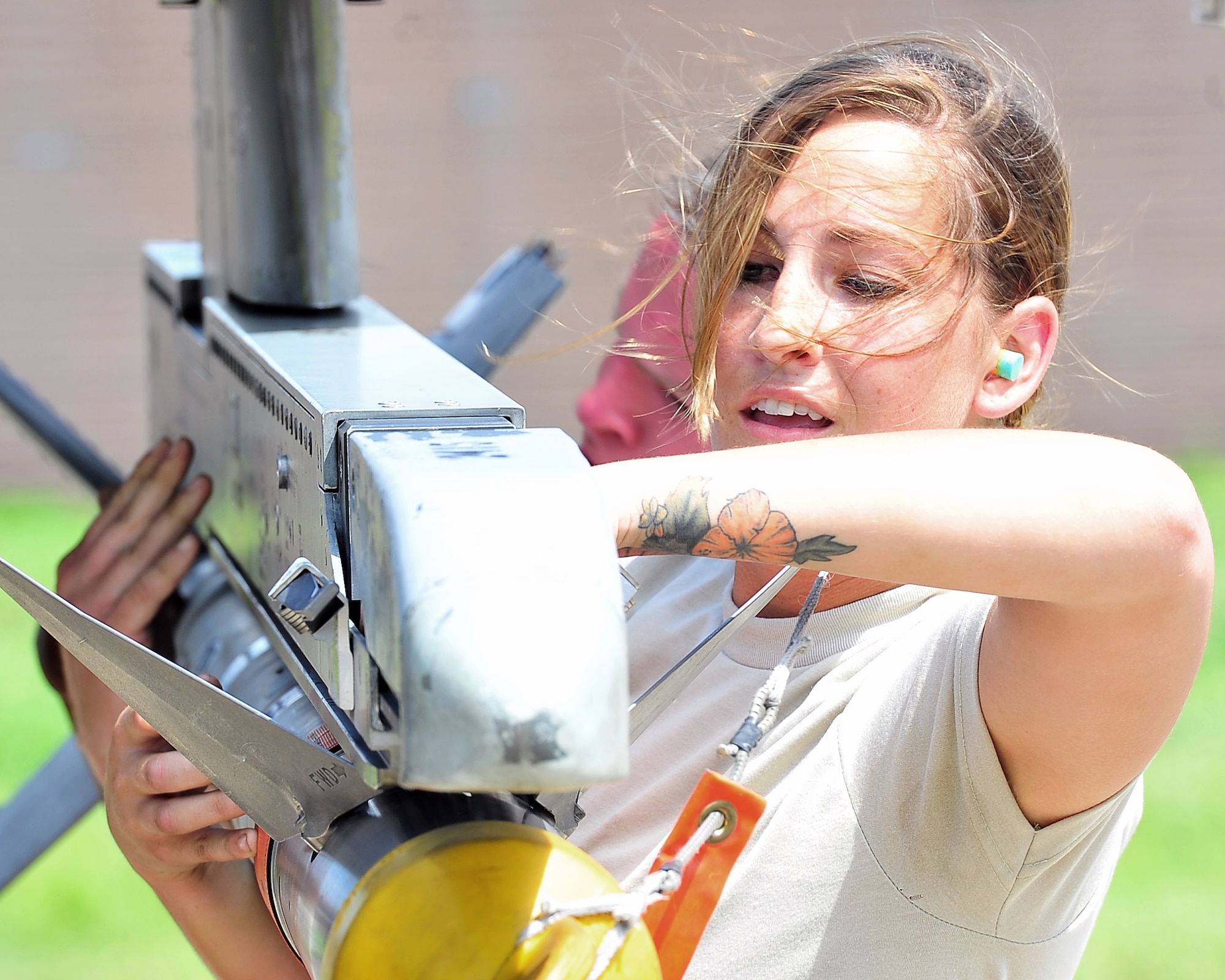Senior Airman Faith Richards, 36th Aircraft Maintenance Unit weapons loader, loads an Aim-9 L-M Sidewinder missile during the 2nd quarter weapons load competition at Osan Air Base, Republic of Korea, Aug. 3, 2012. Load competitions promote a safe, competitive environment where Airmen display their training. The 75th EFS is on a six-month deployment to Korea from Moody Air Force Base, Ga. (U.S. Air Force photo/Tech. Sgt. Raymond Mills)