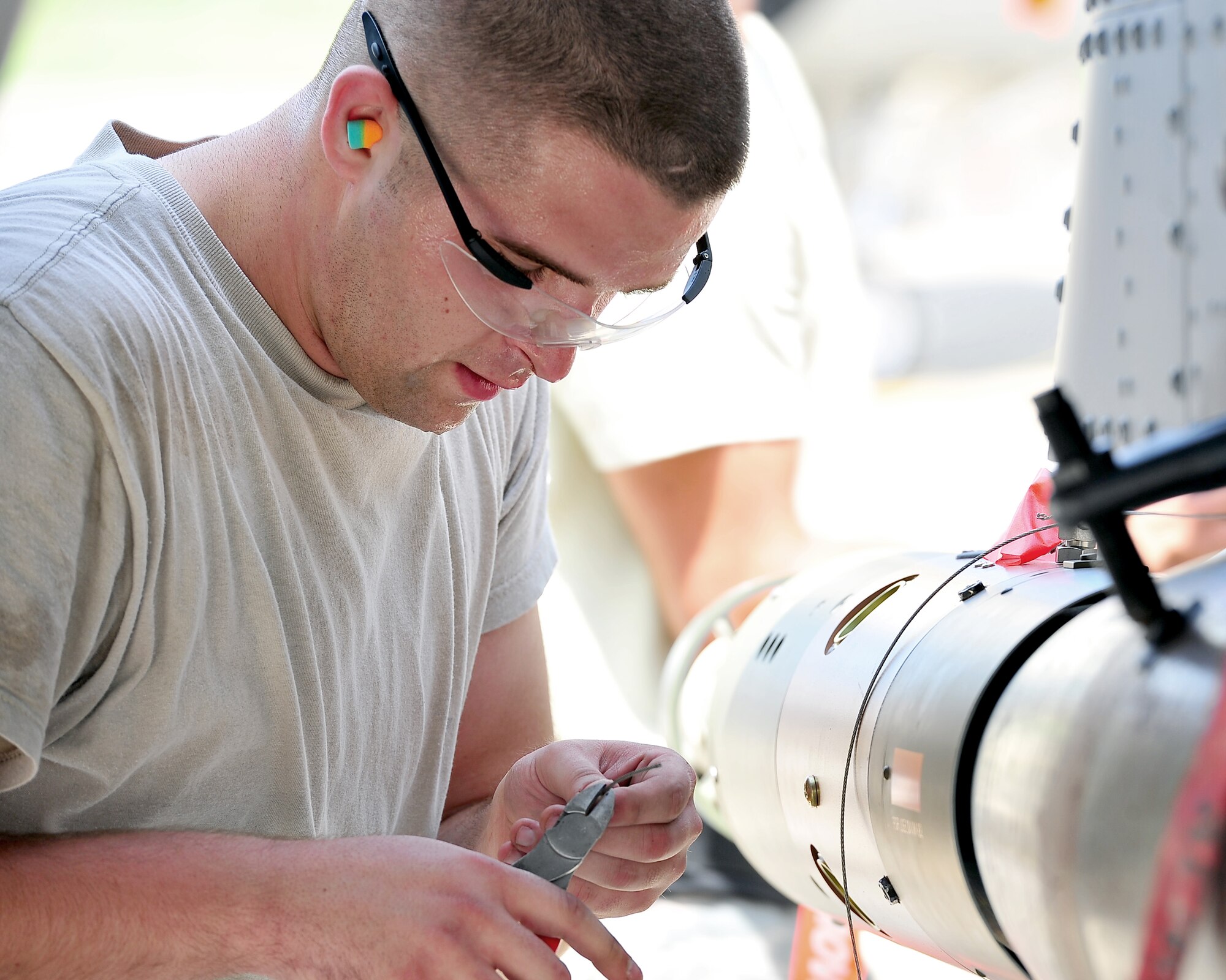 Senior Airman Brannan Ledbetter, 723rd Aircraft Maintenance Squadron weapons loader, secures a guided bomb unit during the 2nd quarter load competition at Osan Air Base, Republic of Korea, Aug. 3, 2012. The 75th Expeditionary Fighter Squadron won the competition, securing the coveted trophy. The 75th EFS is on a six-month deployment to Korea from Moody Air Force Base, Ga. (U.S. Air Force photo/Tech. Sgt. Raymond Mills)