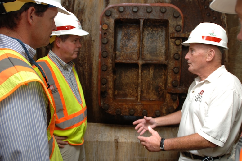 JAMESTOWN, Ky. — Larry Craig (right), U.S. Army Corps of Engineers Nashville District power project manager, leads Nashville Mayor Karl Dean (center) and Scott Potter, director of Nashville's Metro Water Services, on a tour of the Wolf Creek Dam Hydropower Plant Aug. 7, 2012