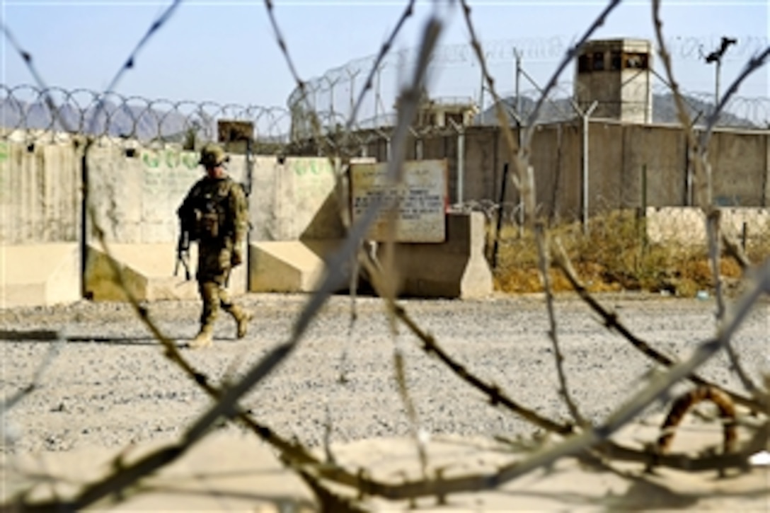 U.S. Army Sgt. Thomas Belli leaves Camp Nathan Smith on a dismounted patrol to survey equipment at a public works facility in Afghanistan's Kandahar province, Aug. 8, 2012. Belli is assigned to the Kandahar Provincial Reconstruction Team.