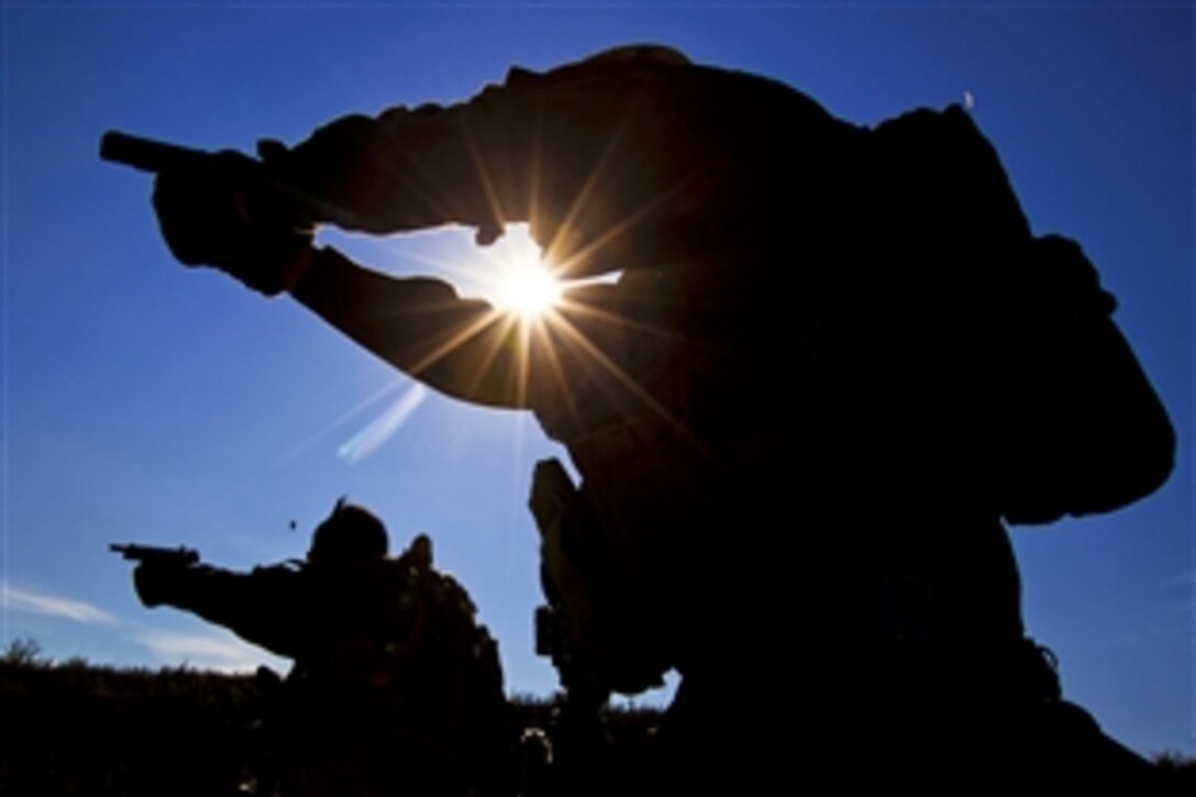 U.S. Marines engage steel targets with fragmenting ammunition during an exercise as part of its predeployment training at a compound in Crawfordsville, Ark., Aug. 9, 2012. The Marines are assigned to Charlie Company, 2nd Reconnaissance Battalion, 26th Marine Expeditionary Unit.