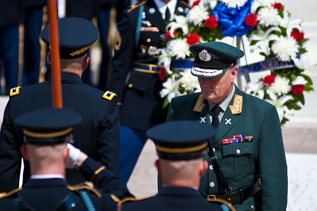 Gen. Harald Sunde, Norway chief of defense, returns to his spot after laying a ceremonial wreath in front of the Tomb of the Unknown Soldier in Arlington, Va., Aug. 13.